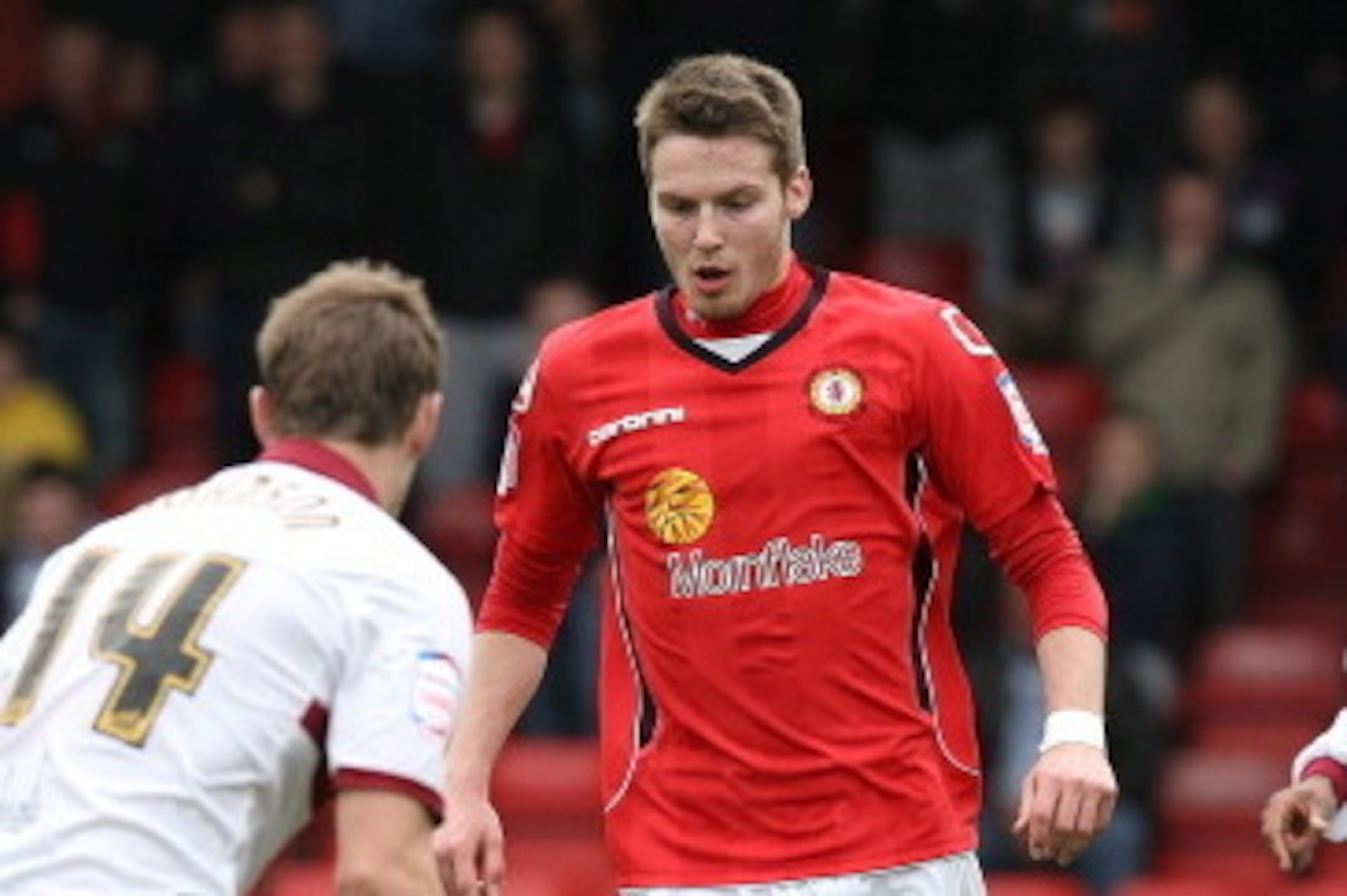 CREWE, ENGLAND - MARCH 31:  Nick Powell of Crewe Alexandra moves against John Johnson of Northampton Town during the npower League Two match between Crewe Alexandra and Northampton Town at The Alexandra Stadium on March 31, 2012 in Crewe, England.  (Photo
