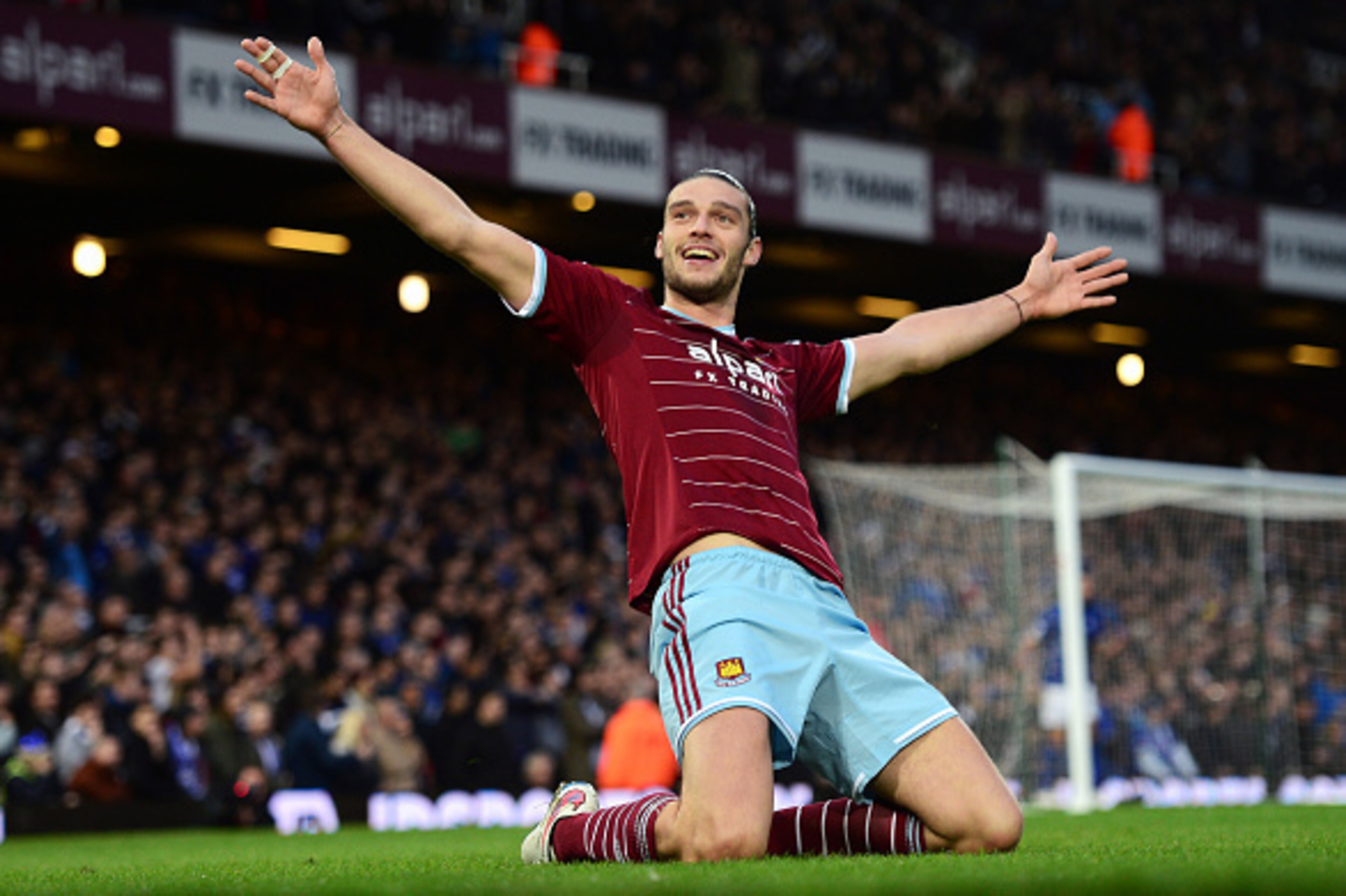 LONDON, ENGLAND - DECEMBER 20: (EDITORS NOTE: This is a re-transmission of image #460712932 with an alternative crop)   Andy Carroll of West Ham celebrates scoring the first goal during the Barclays Premier League match between West Ham United and Leicest