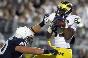 STATE COLLEGE, PA - OCTOBER 12:  Devin Funchess #87 of the Michigan Wolverines catches a 37 yard touchdown pass against Glenn Carson #40 of the Penn State Nittany Lions during the game on October 12, 2013 at Beaver Stadium in State College, Pennsylvania. 