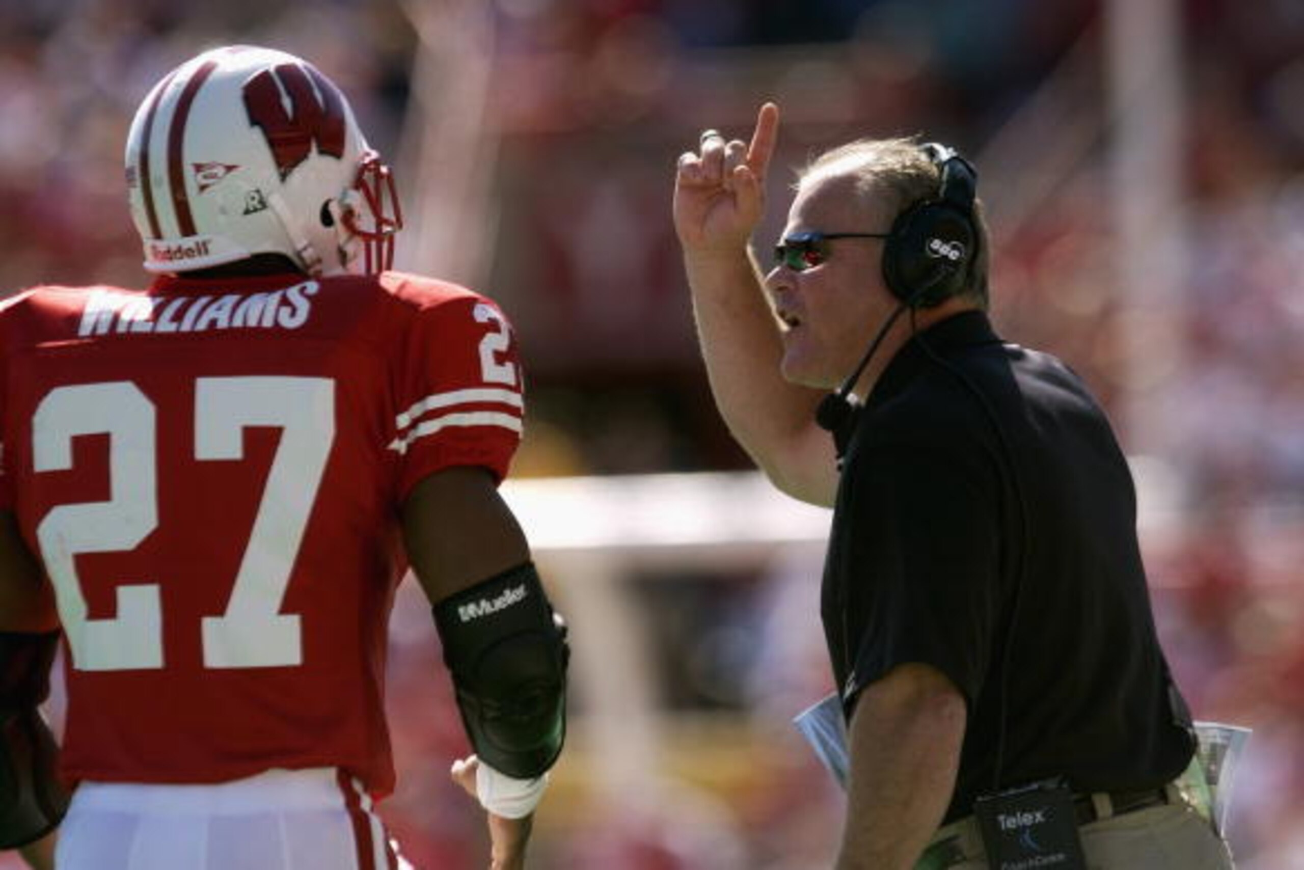 MADISON, WI - SEPTEMBER 21:  Linebacker Broderick Williams #27 of the Wisconsin Badgers listens to defensive coordinator Kevin Cosgrove during the NCAA football game against the Arizona Wildcats on September 21, 2002 at Camp Randall Stadium in Madison, Wi