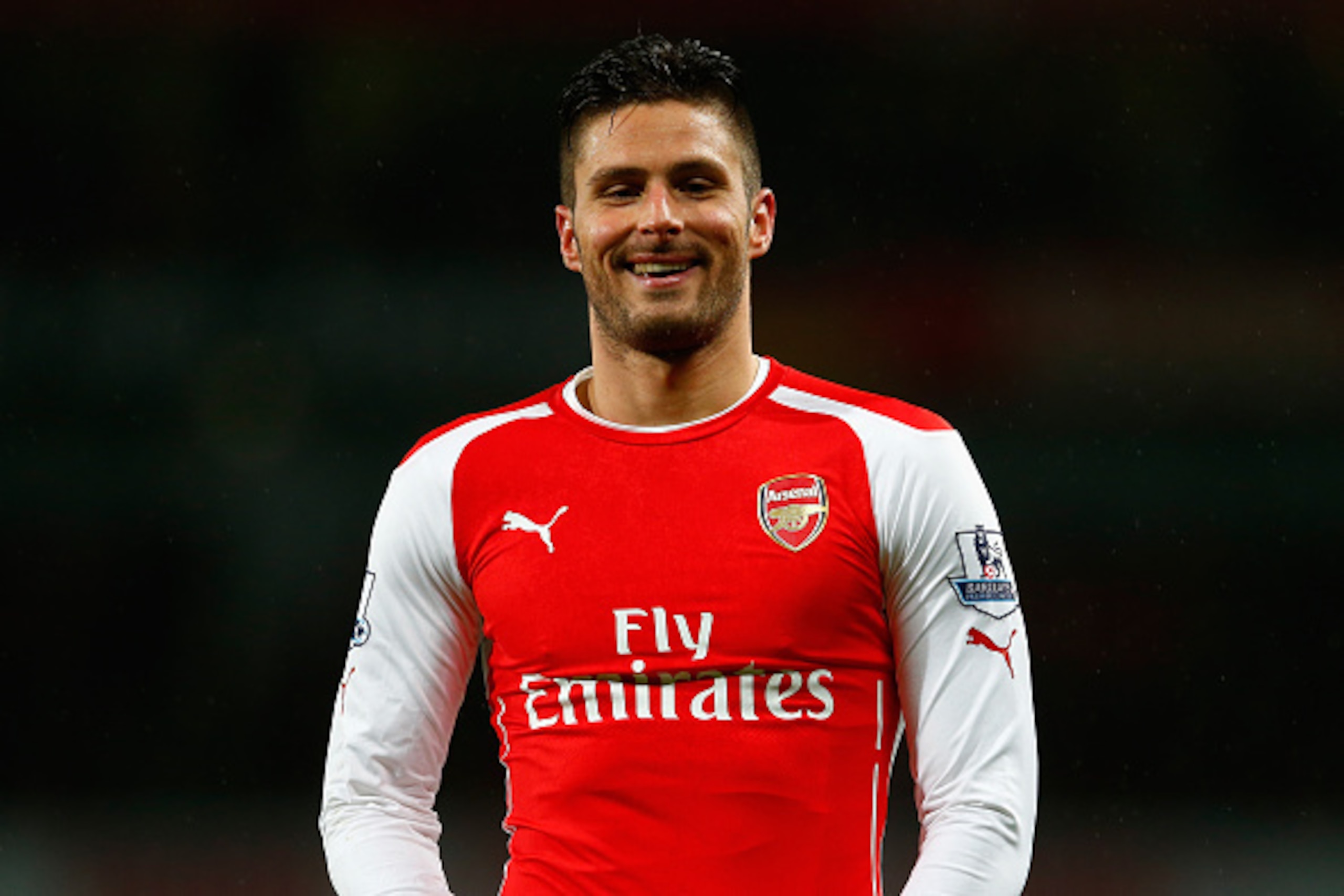 LONDON, ENGLAND - DECEMBER 26:  Olivier Giroud of Arsenal smiles during the Barclays Premier League match between Arsenal and Queens Park Rangers at Emirates Stadium on December 26, 2014 in London, England.  (Photo by Julian Finney/Getty Images)