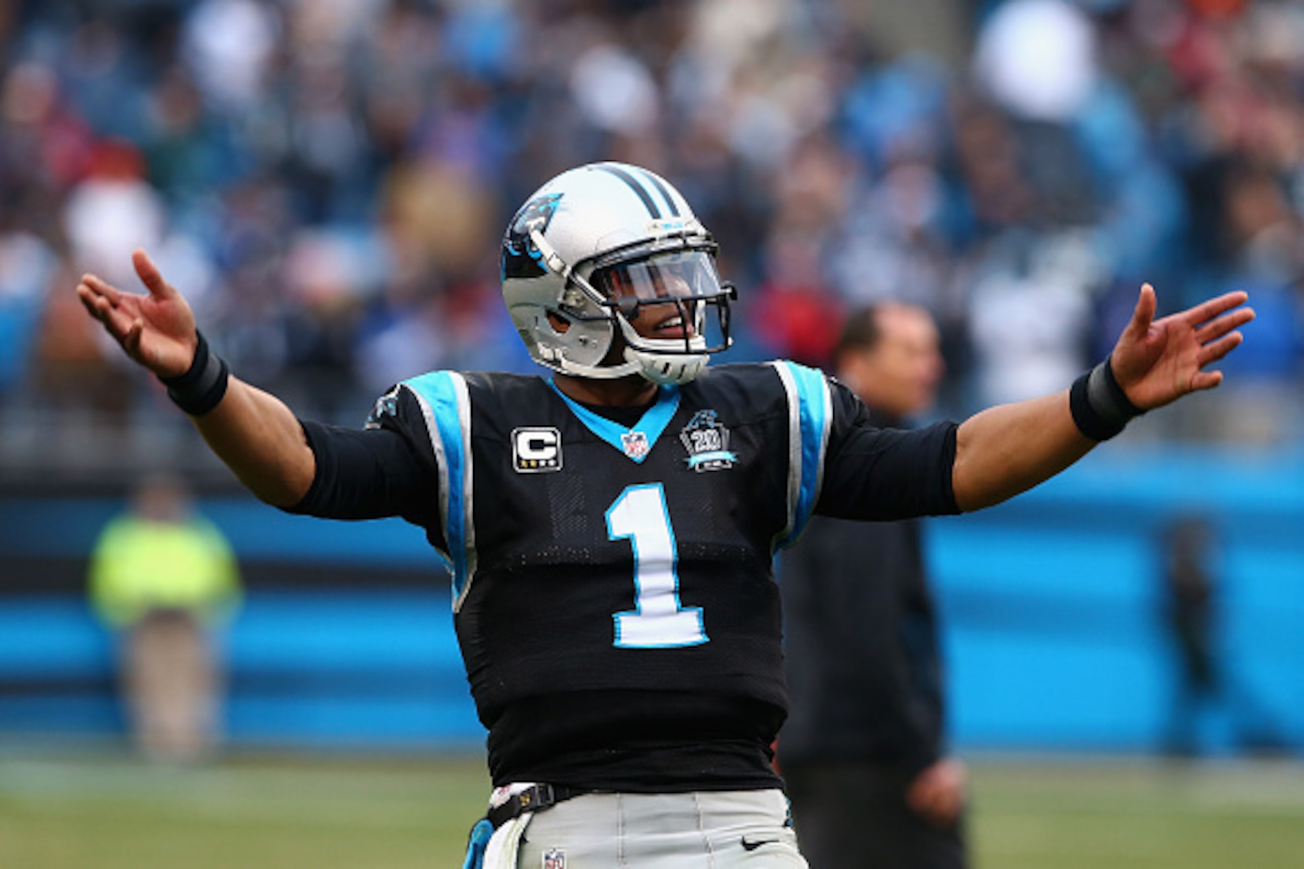 CHARLOTTE, NC - DECEMBER 21:   Cam Newton #1 of the Carolina Panthers salutes the crowd after defeating the Cleveland Browns 17-13 at Bank of America Stadium on December 21, 2014 in Charlotte, North Carolina.  (Photo by Streeter Lecka/Getty Images)