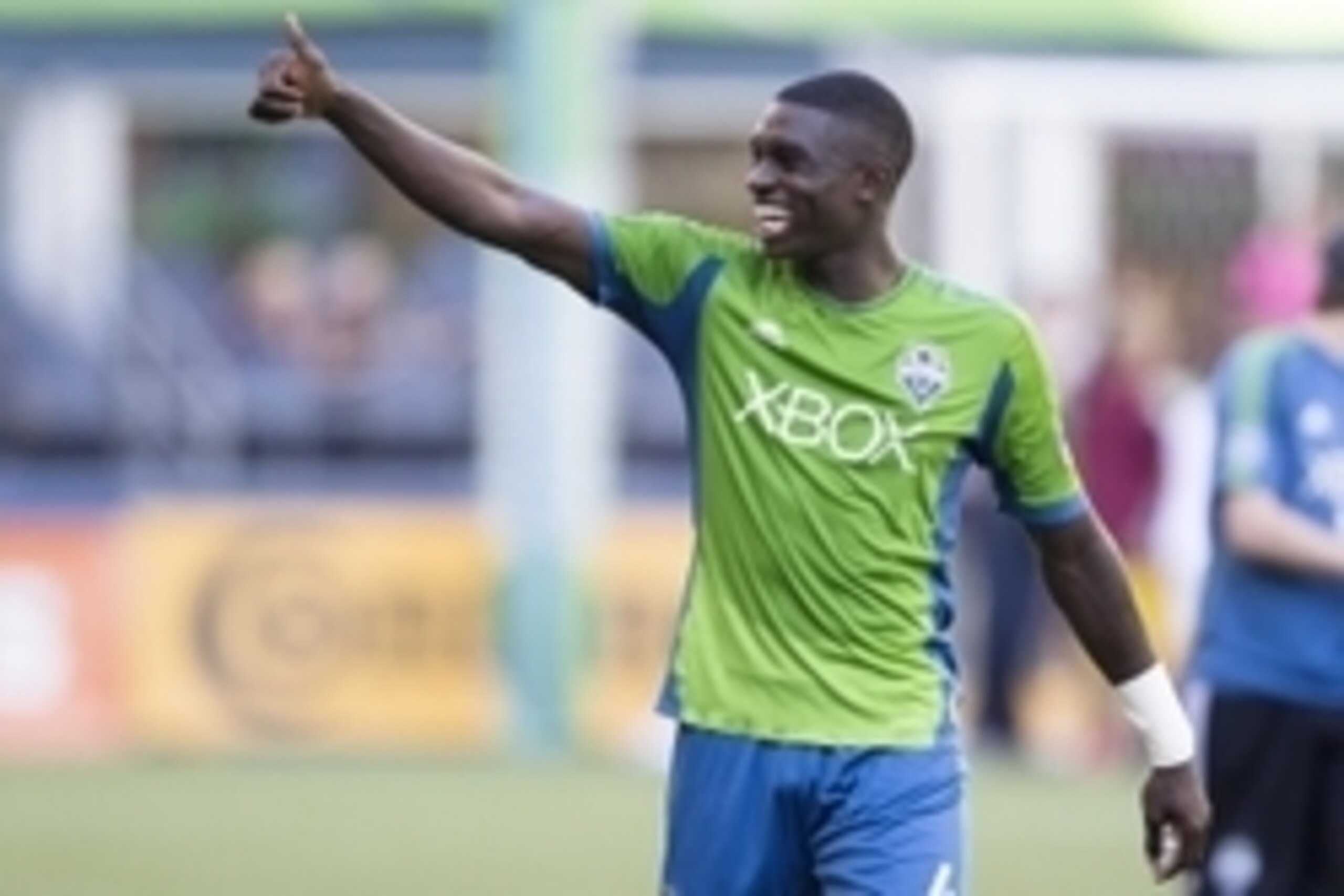 Sep 27, 2014; Seattle, WA, USA; Seattle Sounders FC defender Jalil Anibaba (4) gives fans a thumbs-up  following a 4-2 victory against Chivas USA at CenturyLink Field. Mandatory Credit: Joe Nicholson-USA TODAY Sports
