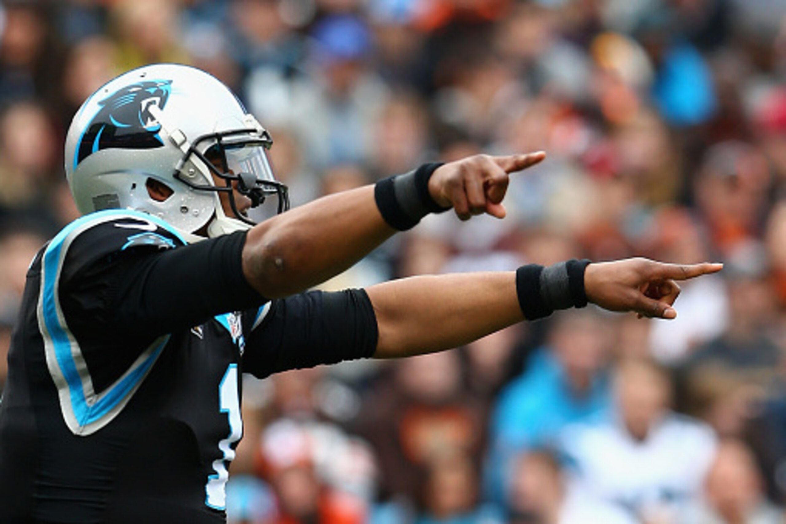 CHARLOTTE, NC - DECEMBER 21:   Cam Newton #1 of the Carolina Panthers makes a call at the line of scrimmage against the Cleveland Browns in the 1st half during their game at Bank of America Stadium on December 21, 2014 in Charlotte, North Carolina.  (Phot