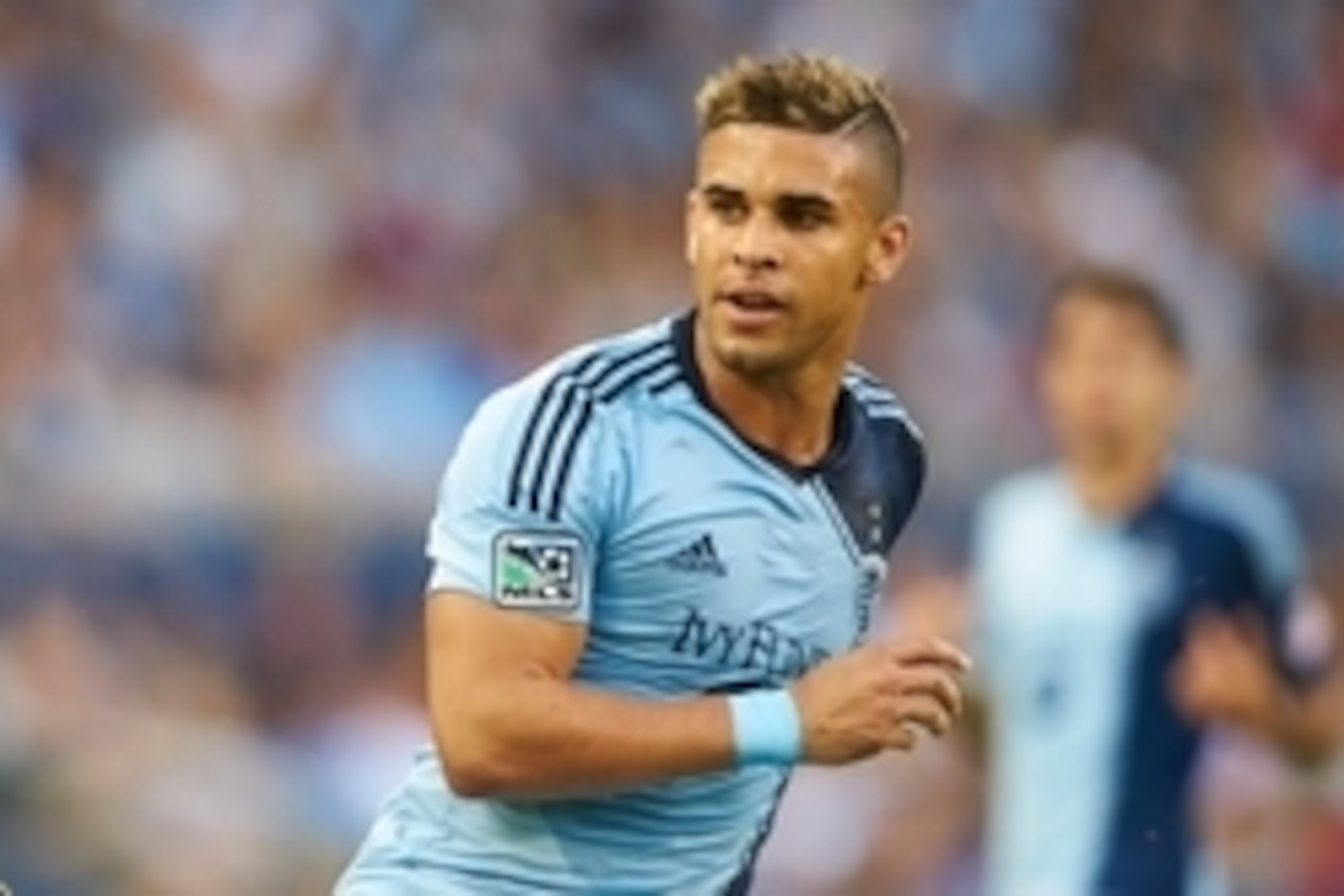 Aug 1, 2014; Kansas City, KS, USA; Sporting Kansas City forward Dom Dwyer (14) looks on after he passes the ball at Sporting Park. Mandatory Credit: Gary Rohman/Sporting KC-USA TODAY Sports