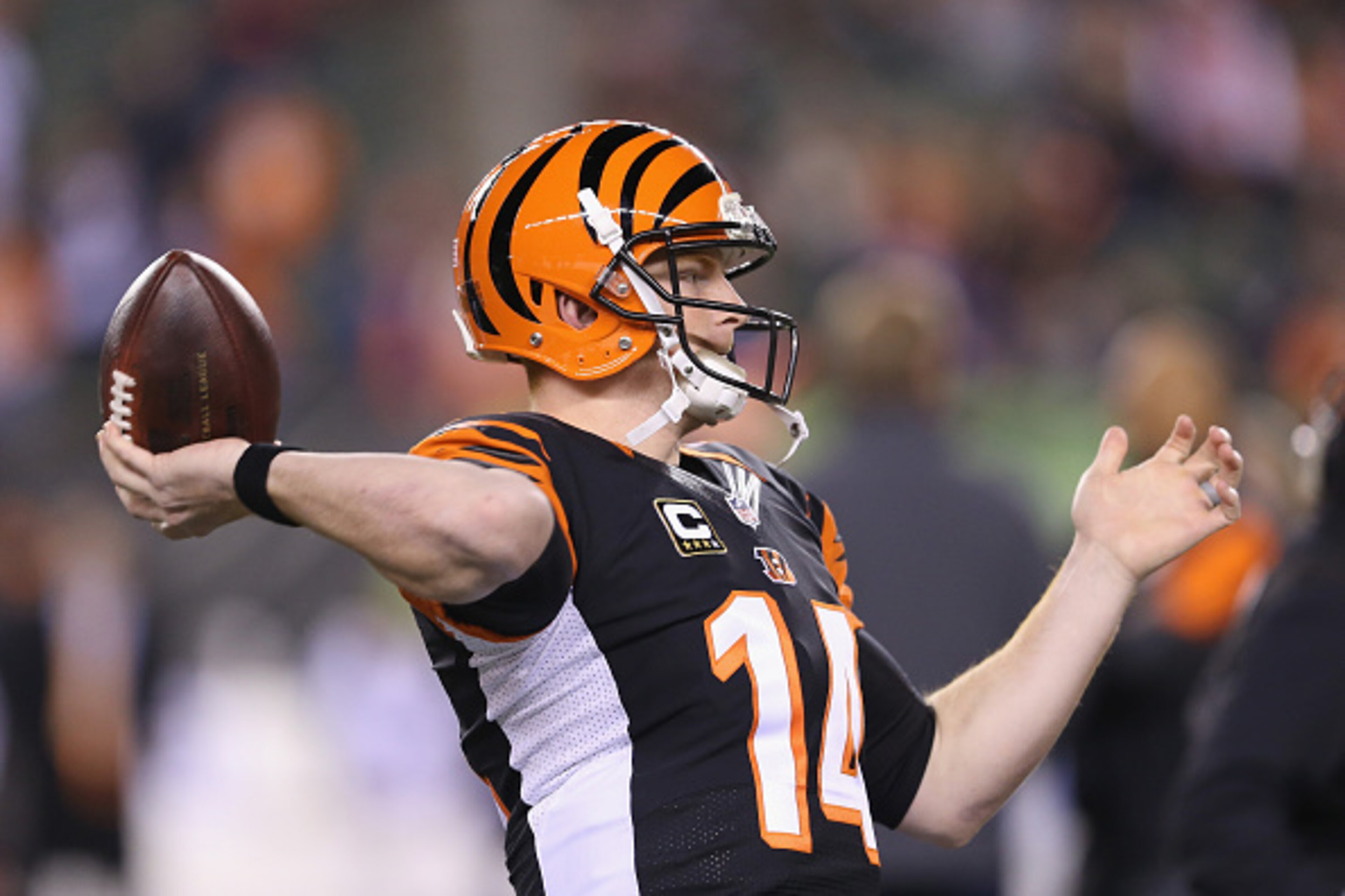 CINCINNATI, OH - DECEMBER 22:  Andy Dalton #14 of the Cincinnati Bengals throws a pass before the game against the Denver Broncos at Paul Brown Stadium on December 22, 2014 in Cincinnati, Ohio.  (Photo by Andy Lyons/Getty Images)