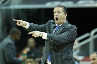 LOUISVILLE, KY - DECEMBER 27:  John Calipari the head coach of the Kentucky Wildcats gives instructions to his team during the 58-50 win over the Louisville Cardinals at KFC YUM! Center on December 27, 2014 in Louisville, Kentucky.  (Photo by Andy Lyons/G