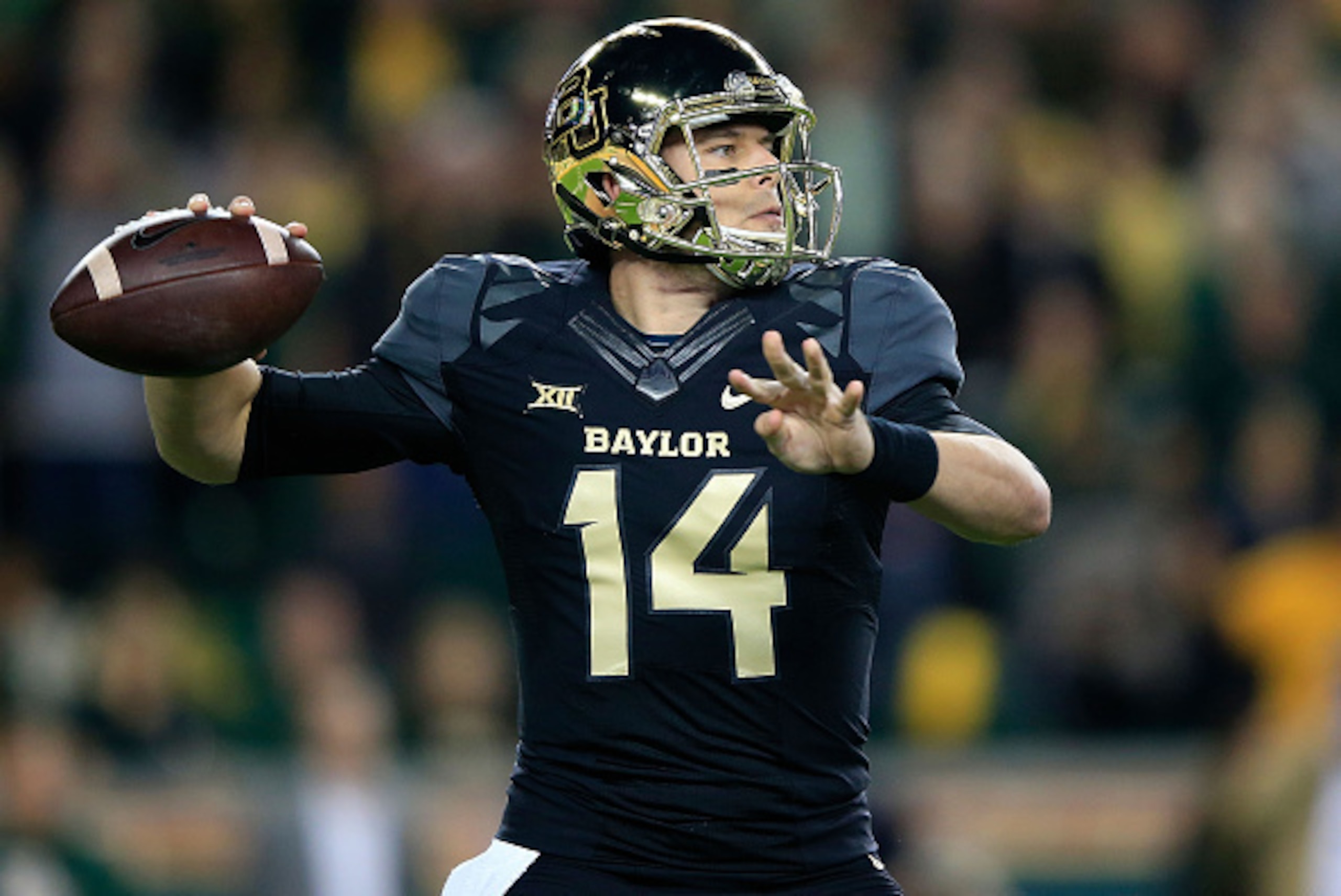 WACO, TX - DECEMBER 06:  Bryce Petty #14 of the Baylor Bears passes against the Kansas State Wildcats during the first half of the game on December 6, 2014  at McLane Stadium in Waco, Texas.  (Photo by Jamie Squire/Getty Images)