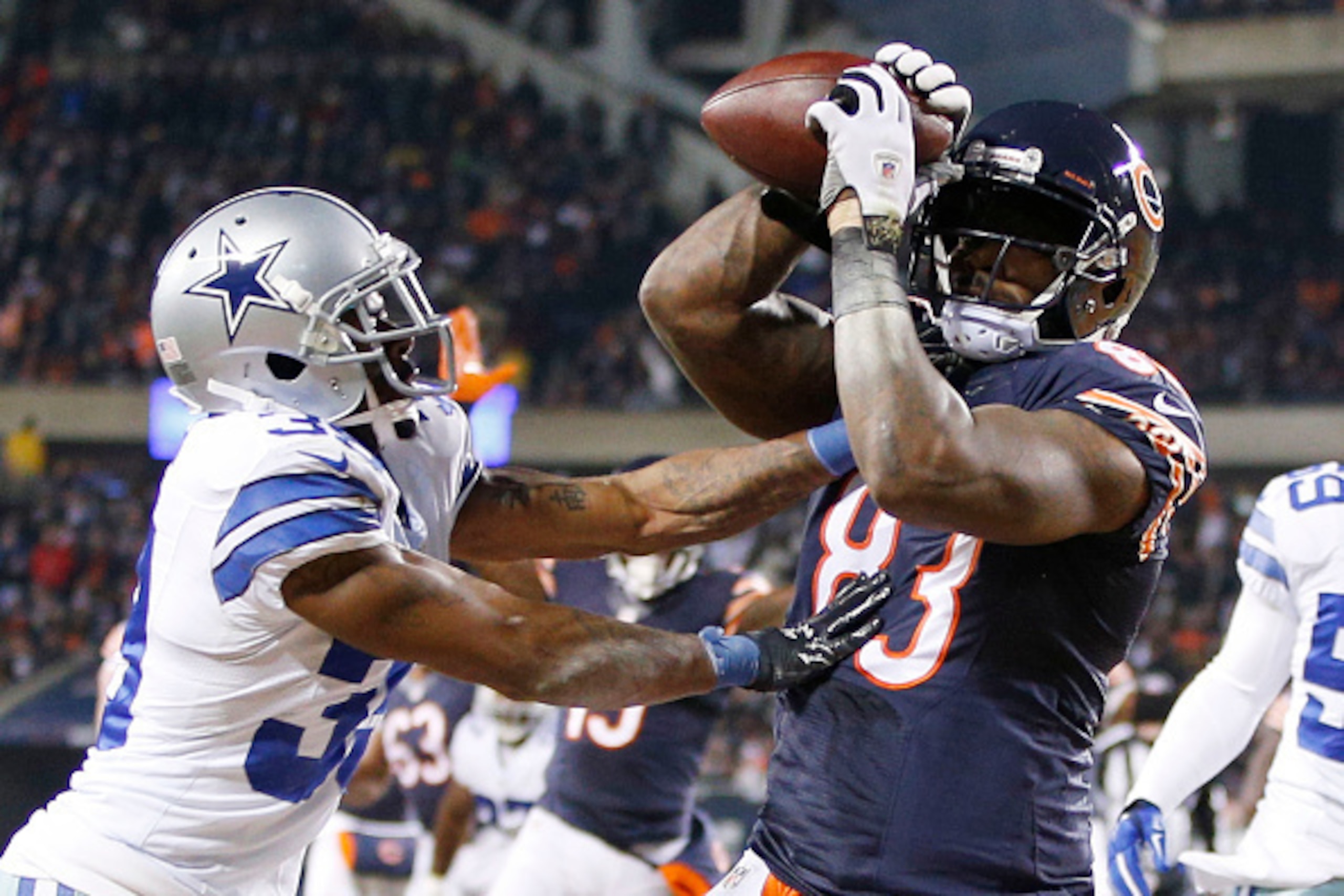 CHICAGO, IL - DECEMBER 4: Martellus Bennett #83 of the Chicago Bears scores a touchdown over Brandon Carr #39 of the Dallas Cowboys during the second quarter of a game at Soldier Field on December 4, 2014 in Chicago, Illinois. (Photo by Joe Robbins/Getty 