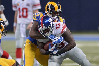 ST. LOUIS, MO - DECEMBER 21:  Alec Ogletree #52 of the St. Louis Rams tackles Orleans Darkwa #43 of the New York Giants in the fourth quarter at the Edward Jones Dome on December 21, 2014 in St. Louis, Missouri.  (Photo by Michael B. Thomas/Getty Images)