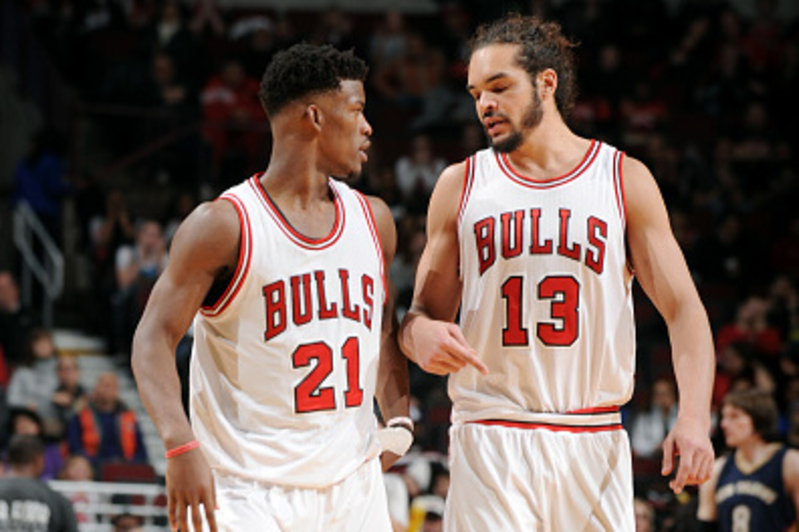 CHICAGO, IL - DECEMBER 27: Jimmy Butler #21 and Joakim Noah #13 of the Chicago Bulls speak during a game against the New Orleans Pelicans on December 27, 2014 at the United Center in Chicago, Illinois. NOTE TO USER: User expressly acknowledges and agrees 