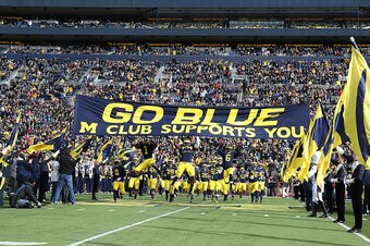 ANN ARBOR, MI - NOVEMBER 1: The Michigan Wolverines enter the stadium prior to the start of the game against the Indiana Hoosiers at Michigan Stadium on November 1 , 2014 in Ann Arbor, Michigan. The Michigan defeated the Hoosiers 34-10. (Photo by Leon Hal