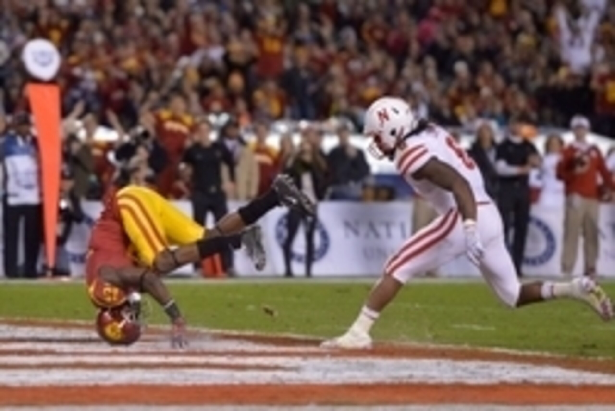 Dec 27, 2014; San Diego, CA, USA; Southern California Trojans receiver Nelson Agholor (15) is defended by Nebraska Cornhuskers linebacker Ameer Abdullah (8) on a 17-yard touchdown reception in the second quarter in the 2014 Holiday Bowl at Qualcomm Stadiu