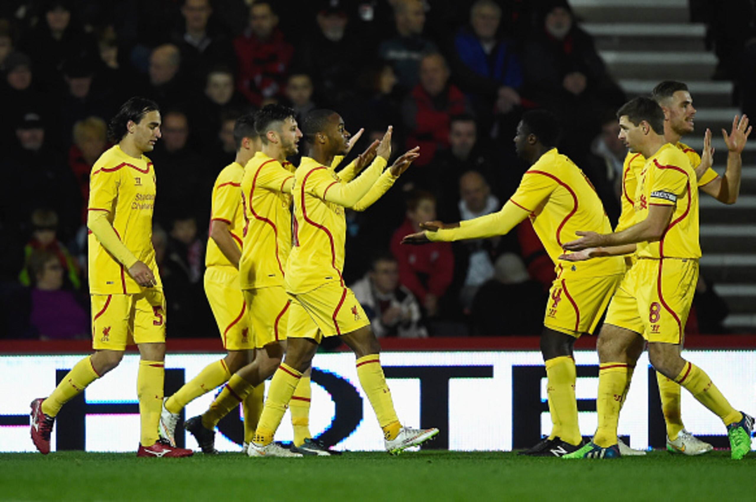 BOURNEMOUTH, ENGLAND - DECEMBER 17:  Raheem Sterling of Liverpool celebrates scoring his team's third goal with Steven Gerrard during the Capital One Cup Quarter-Final match between Bournemouth and Liverpool at Goldsands Stadium on December 17, 2014 in Bo