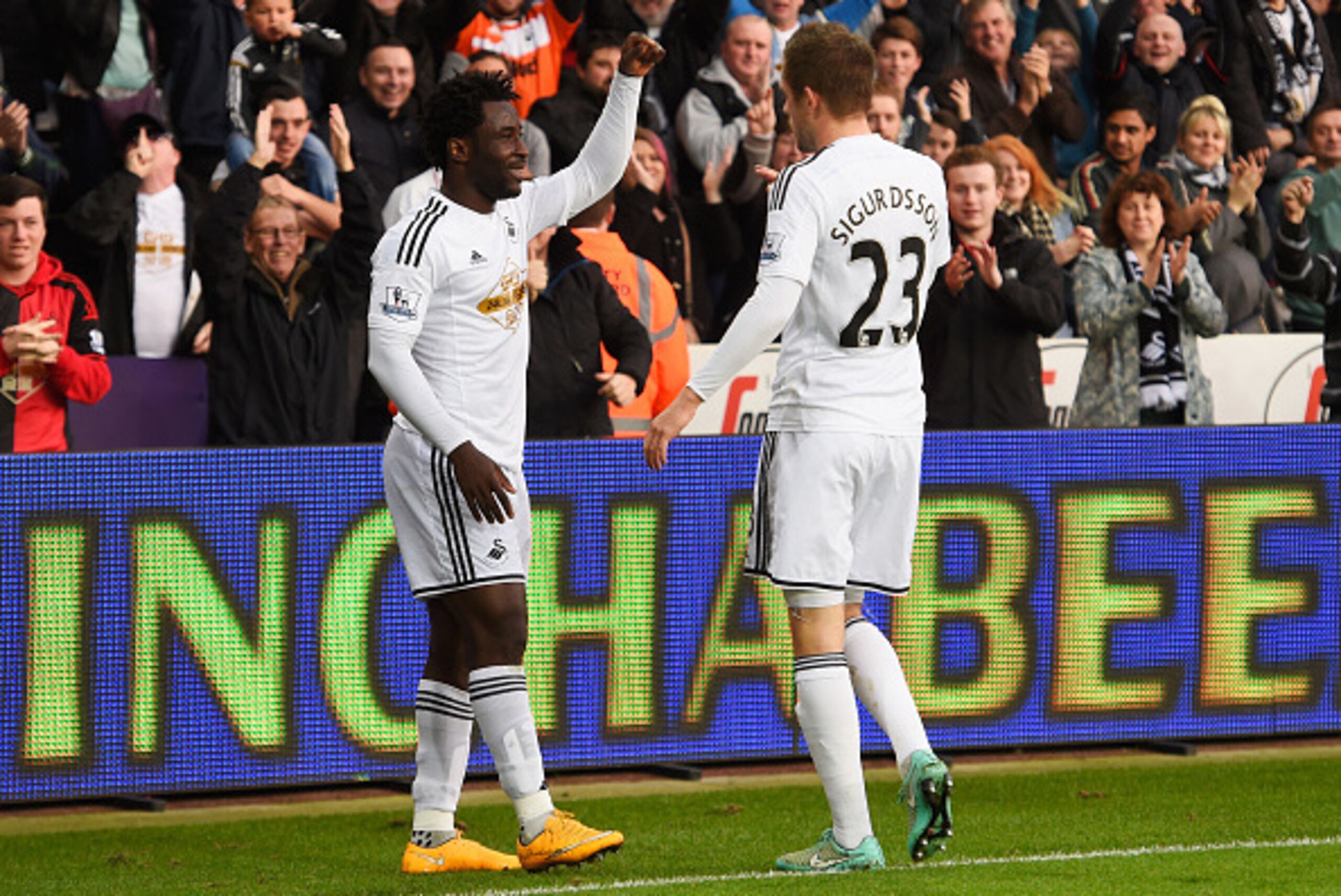 SWANSEA, WALES - NOVEMBER 29:  Wilfried Bony of Swansea City celebrates with Gylfi Sigurdsson as he scores their first goal during the Barclays Premier League match between Swansea City and Crystal Palace at Liberty Stadium on November 29, 2014 in Swansea