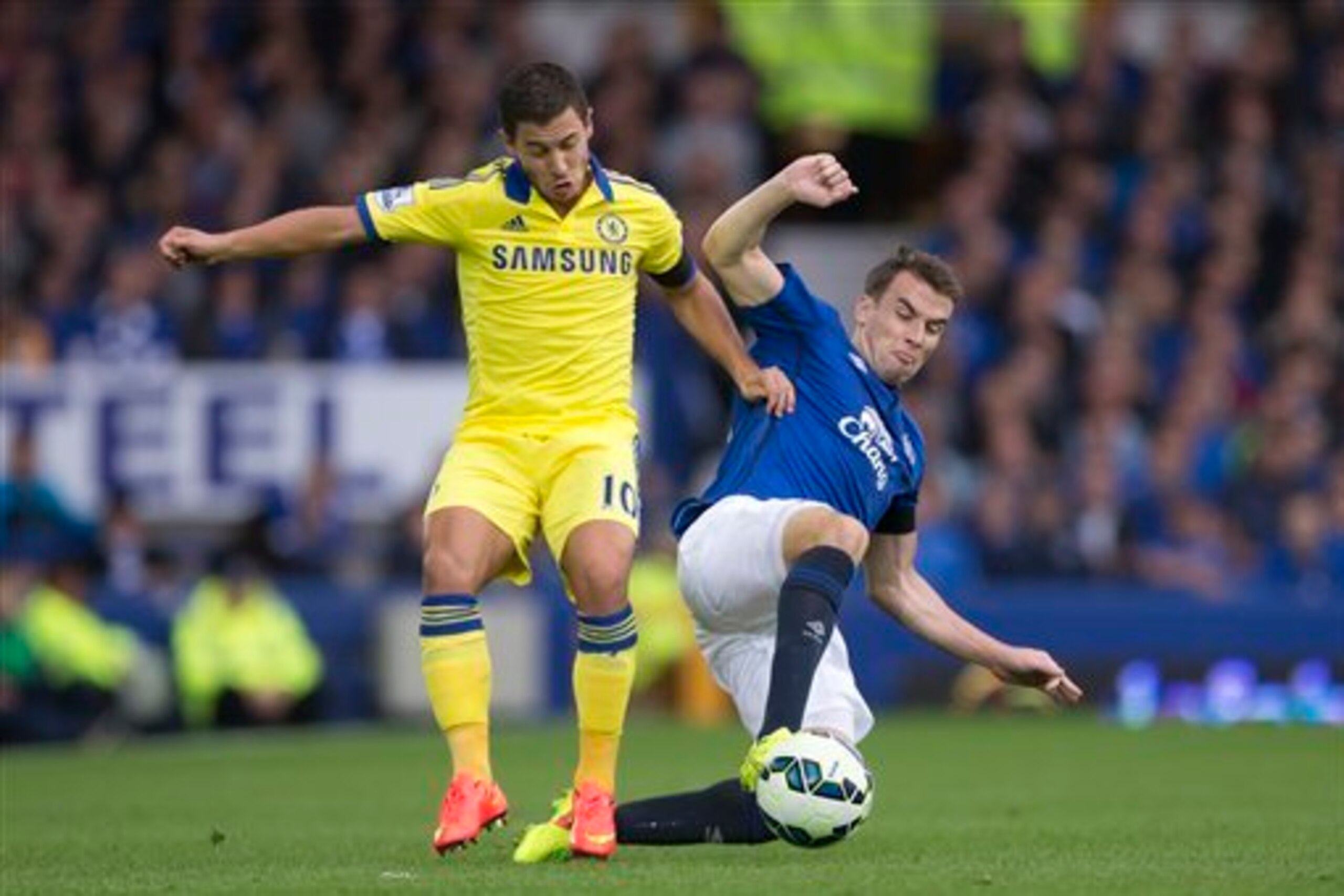 Coleman gets stuck into Eden Hazard earlier in the season.