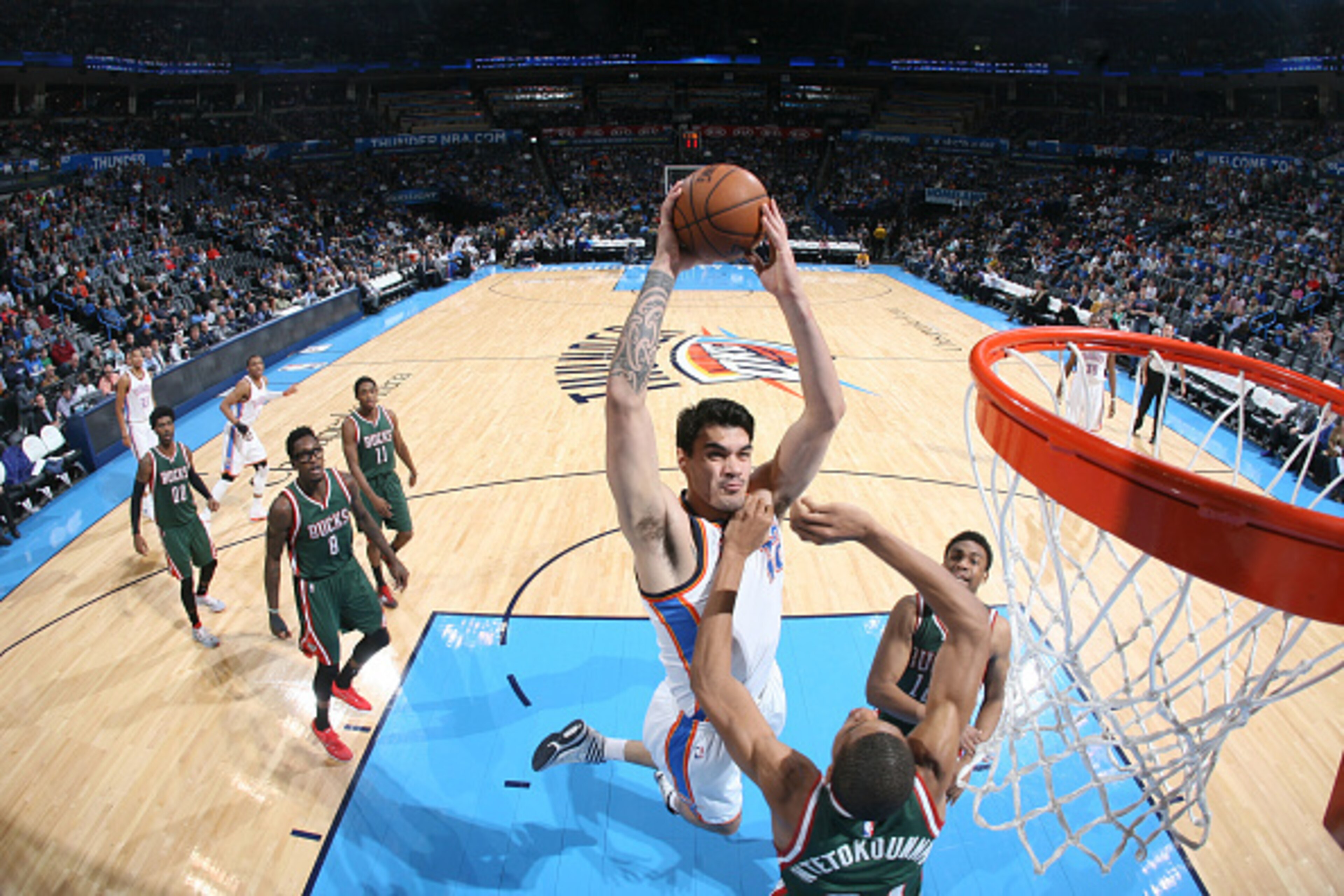 OKLAHOMA CITY, OK- DECEMBER 9: Steven Adams #12 of the Oklahoma City Thunder dunks against the Milwaukee Bucks on December 9, 2014 at Chesapeake Energy Arena in Oklahoma City, OK. NOTE TO USER: User expressly acknowledges and agrees that, by downloading a OKLAHOMA CITY, OK- DECEMBER 9: Steven Adams #12 of the Oklahoma City Thunder dunks against the Milwaukee Bucks on December 9, 2014 at Chesapeake Energy Arena in Oklahoma City, OK. NOTE TO USER: User expressly acknowledges and agrees that, by downloading a