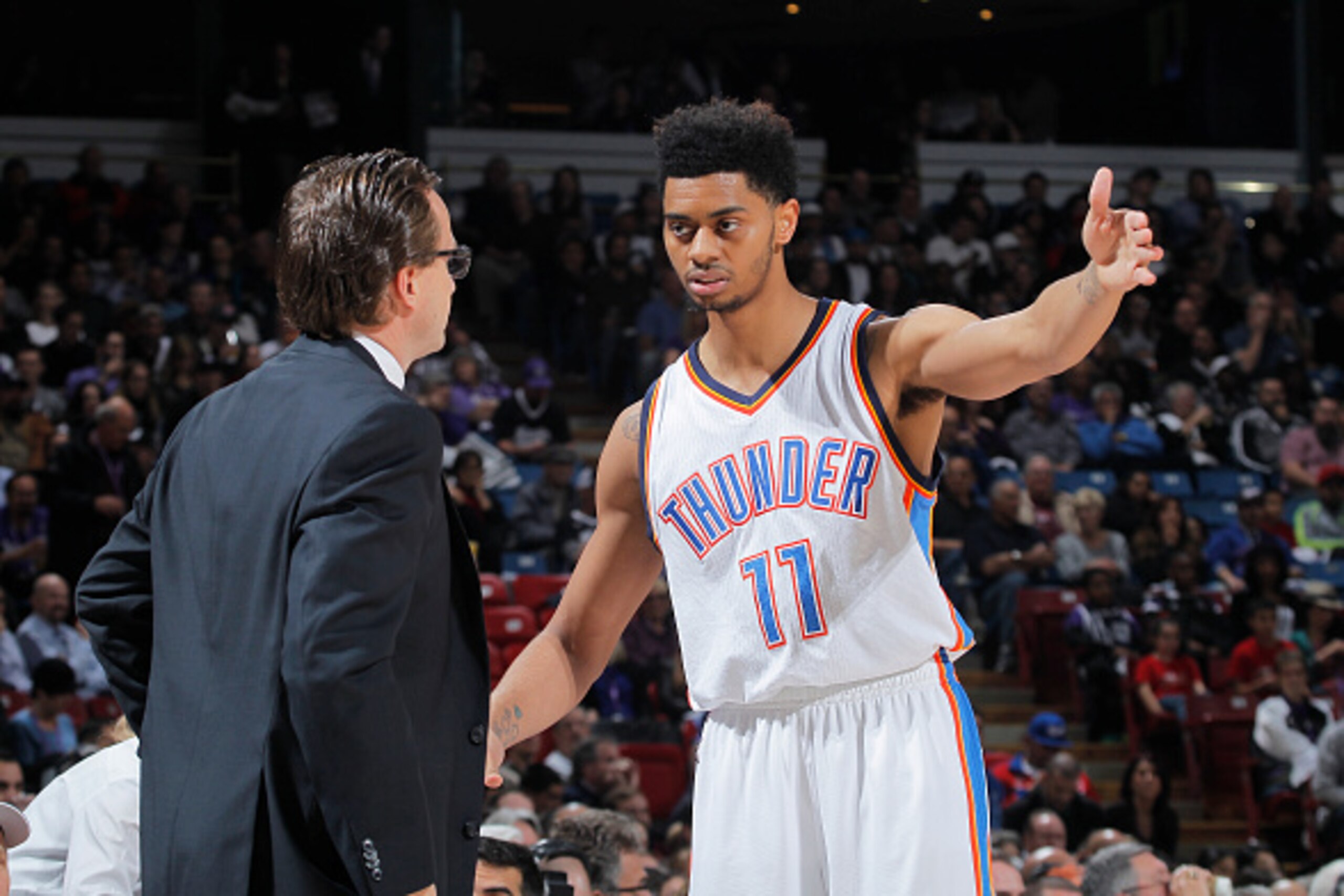 SACRAMENTO, CA - DECEMBER 16: Jeremy Lamb #11 of the Oklahoma City Thunder speaks to Head Coach Scott Brooks against the Sacramento Kings on December 16, 2014 at Sleep Train Arena in Sacramento, California. NOTE TO USER: User expressly acknowledges and ag