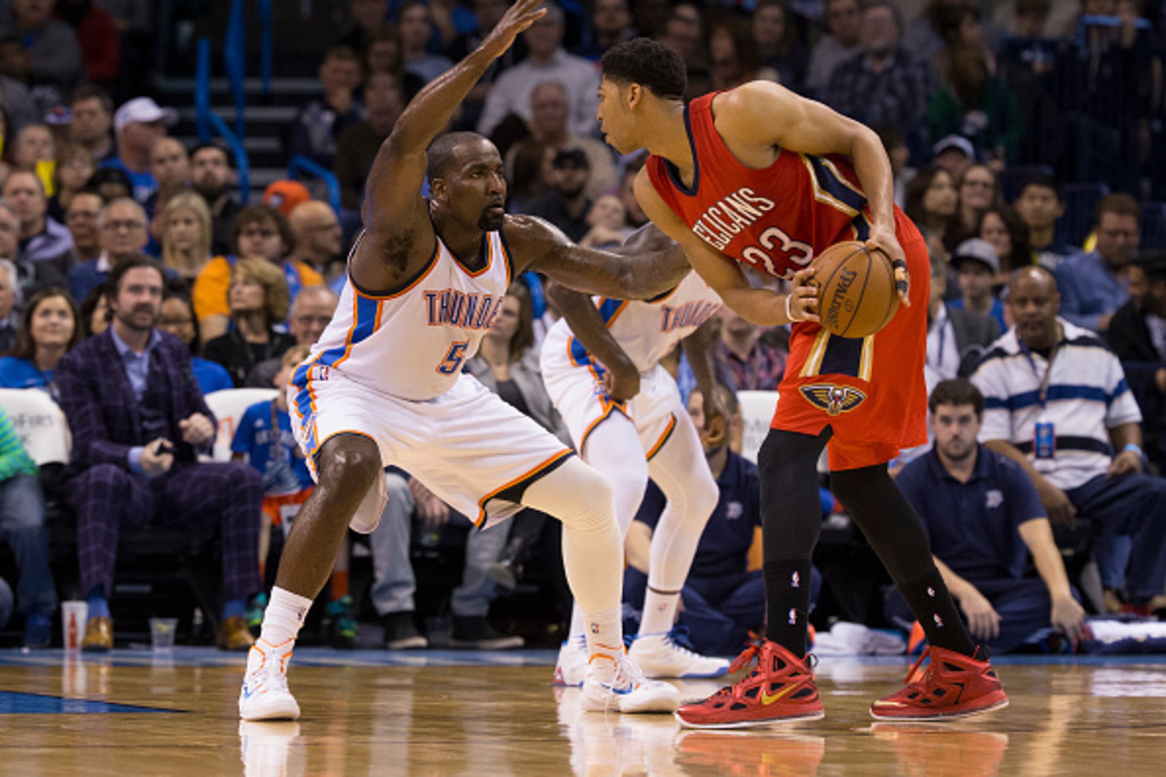 OKLAHOMA CITY, OK - DECEMBER 21: Anthony Davis #23 of the New Orleans Pelicans looks to drive while guarded by Kendrick Perkins #5 of the Oklahoma City Thunder at the Chesapeake Energy Arena on December 21, 2013 in Oklahoma City, Oklahoma. NOTE TO USER: OKLAHOMA CITY, OK - DECEMBER 21: Anthony Davis #23 of the New Orleans Pelicans looks to drive while guarded by Kendrick Perkins #5 of the Oklahoma City Thunder at the Chesapeake Energy Arena on December 21, 2013 in Oklahoma City, Oklahoma. NOTE TO USER: