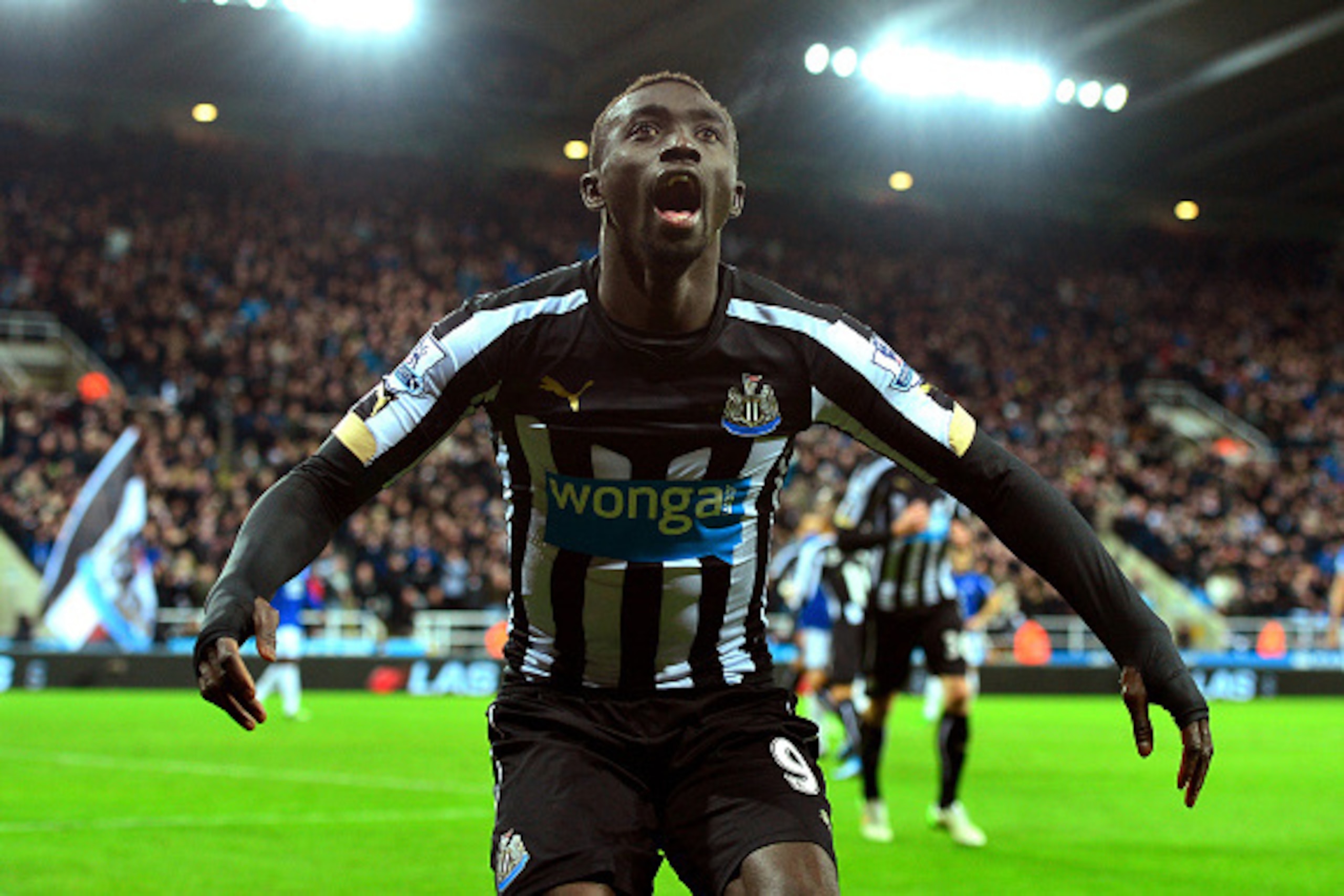 NEWCASTLE UPON TYNE, ENGLAND - DECEMBER 28:  Papiss Demba Cisse of Newcastle United celebrates after scoring a goal to level the scores at 1-1 during the Barclays Premier League match between Newcastle United and Everton at St James' Park on December 28, 