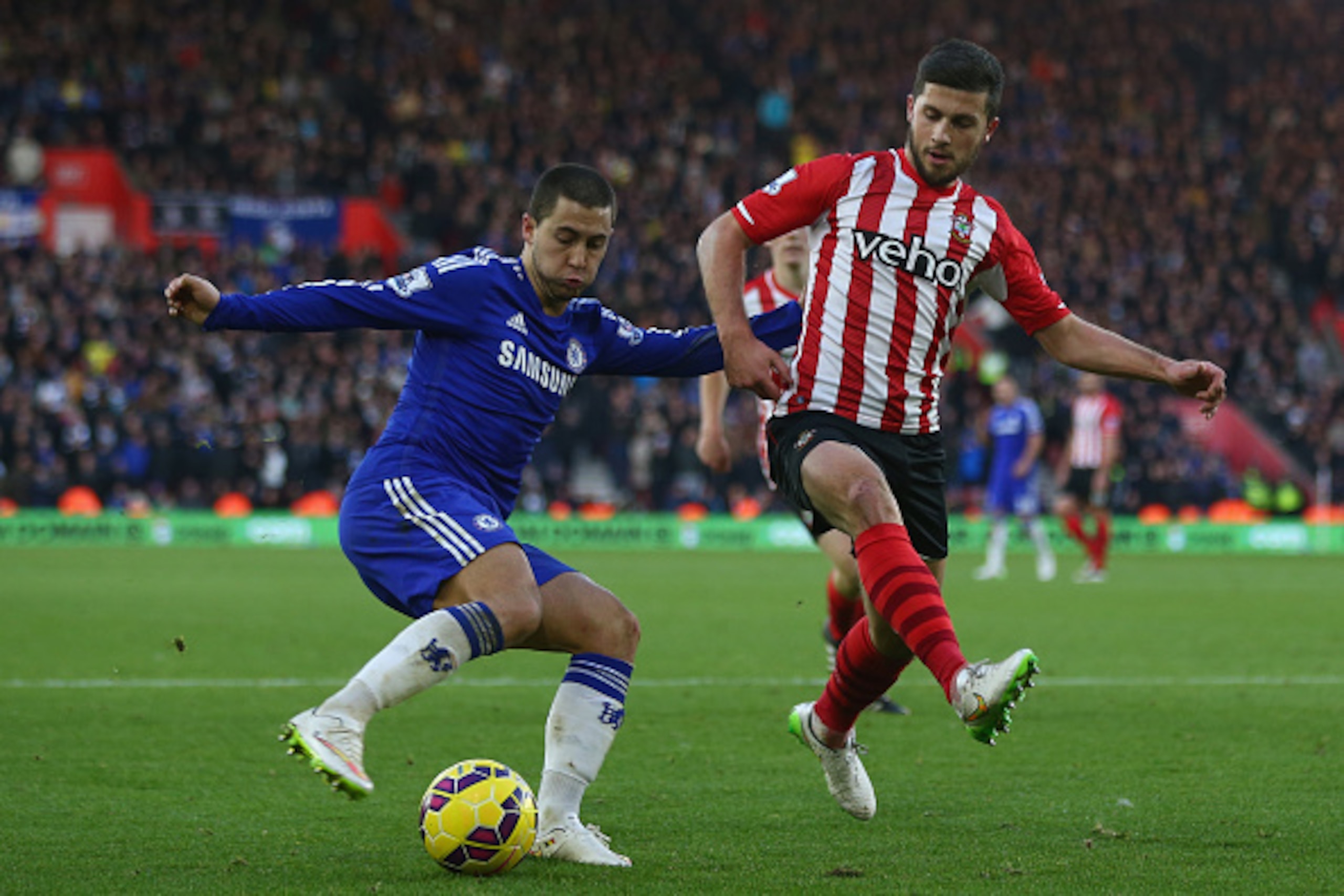 SOUTHAMPTON, ENGLAND - DECEMBER 28: Eden Hazard (L) of Chelsea is tracked by Shane Long (R) of Southampton during the Barclays Premier League match between Southampton and Chelsea at St Mary's Stadium on December 28, 2014 in Southampton, England.  (Photo 
