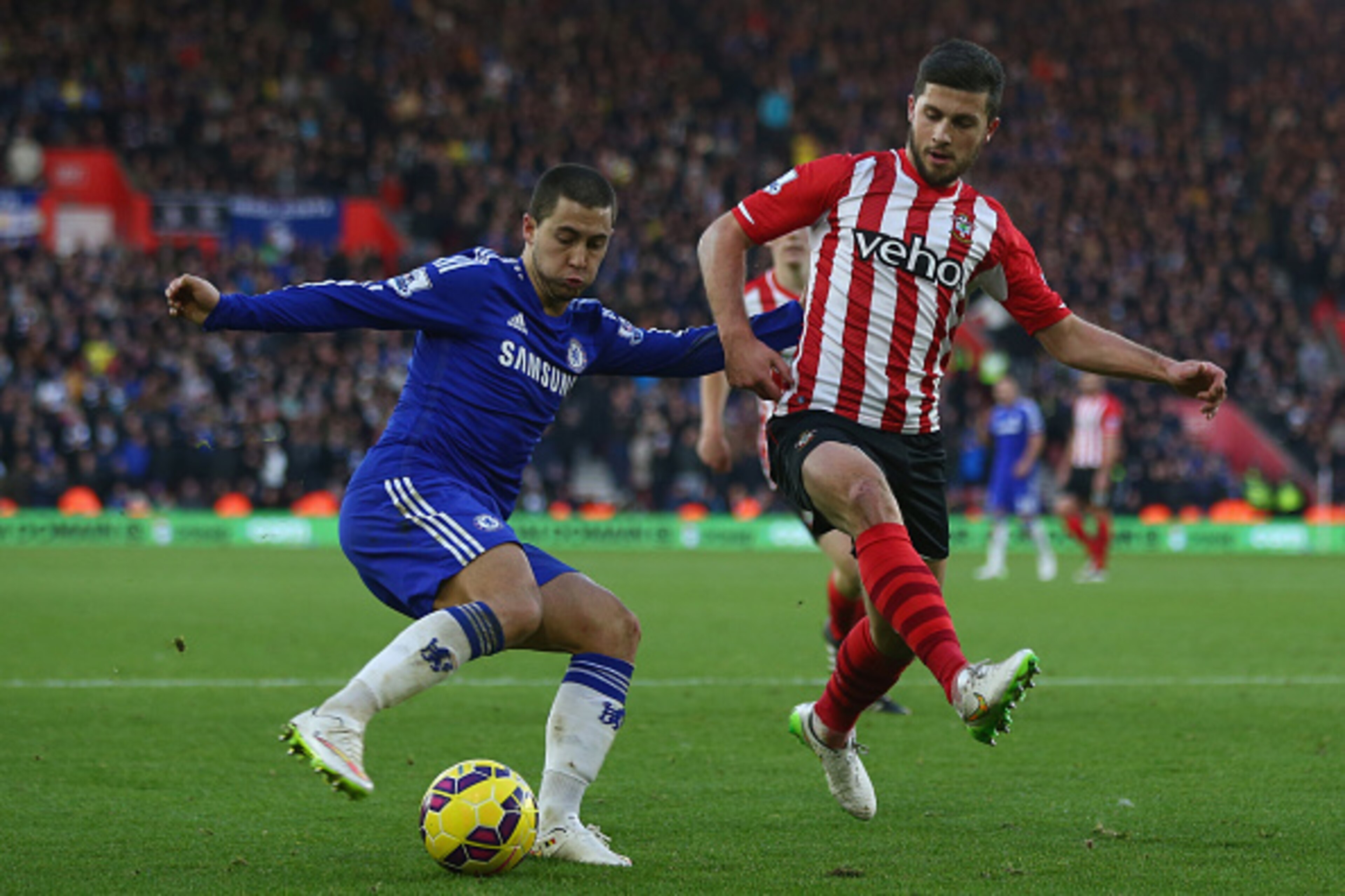SOUTHAMPTON, ENGLAND - DECEMBER 28: Eden Hazard (L) of Chelsea is tracked by Shane Long (R) of Southampton during the Barclays Premier League match between Southampton and Chelsea at St Mary's Stadium on December 28, 2014 in Southampton, England.  (Photo 
