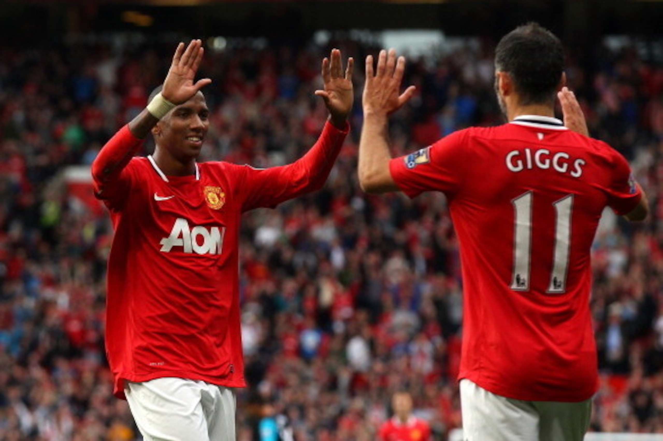 MANCHESTER, ENGLAND - AUGUST 28:  Ashley Young of Manchester United celebrates with Ryan Giggs after scoring his second goal during the Barclays Premier League match between Manchester United and Arsenal at Old Trafford on August 28, 2011 in Manchester, E