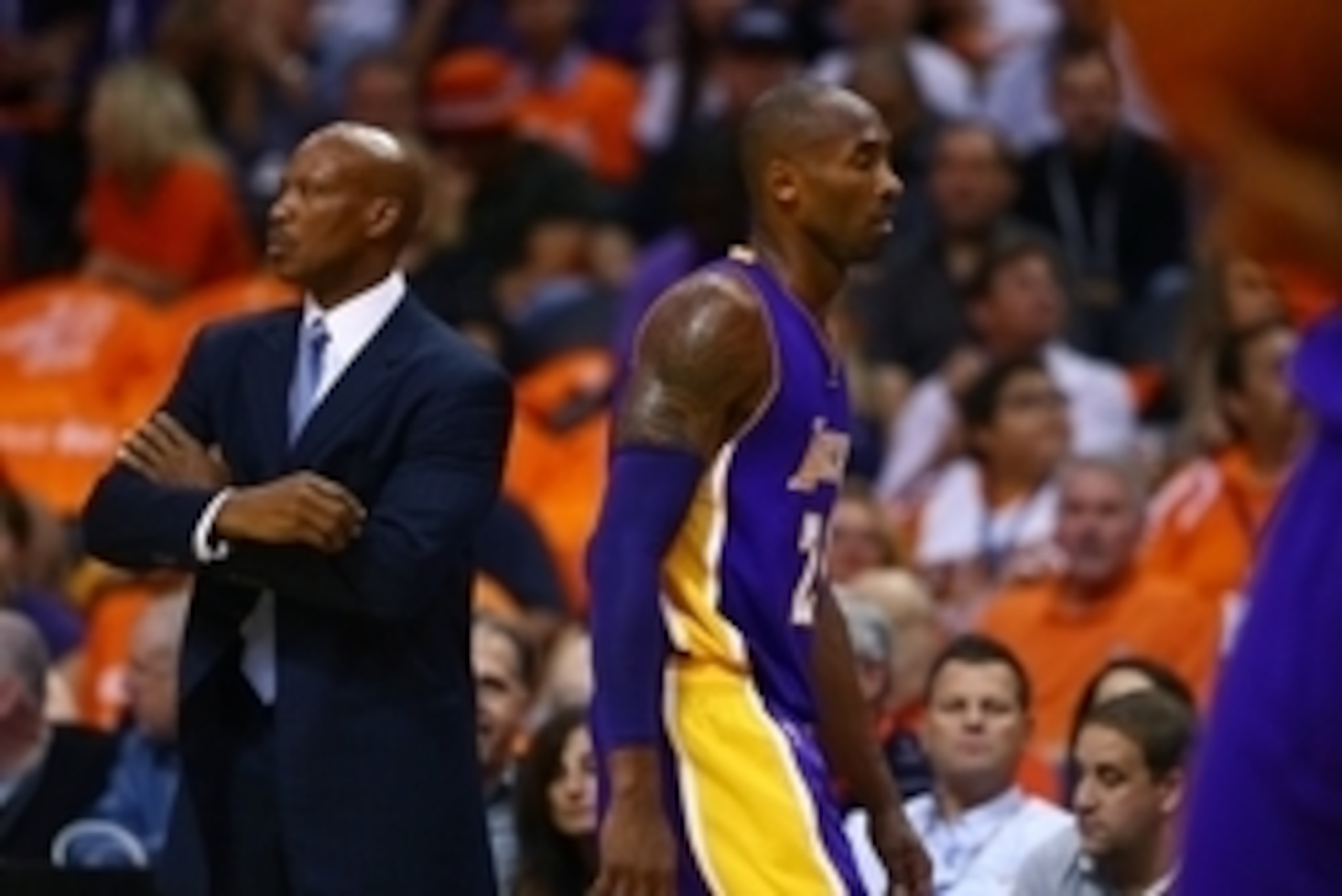 Oct 29, 2014; Phoenix, AZ, USA; Los Angeles Lakers head coach Byron Scott (left) with guard Kobe Bryant in the first half against the Phoenix Suns during the home opener at US Airways Center. The Suns defeated the Lakers 119-99. Mandatory Credit: Mark J.