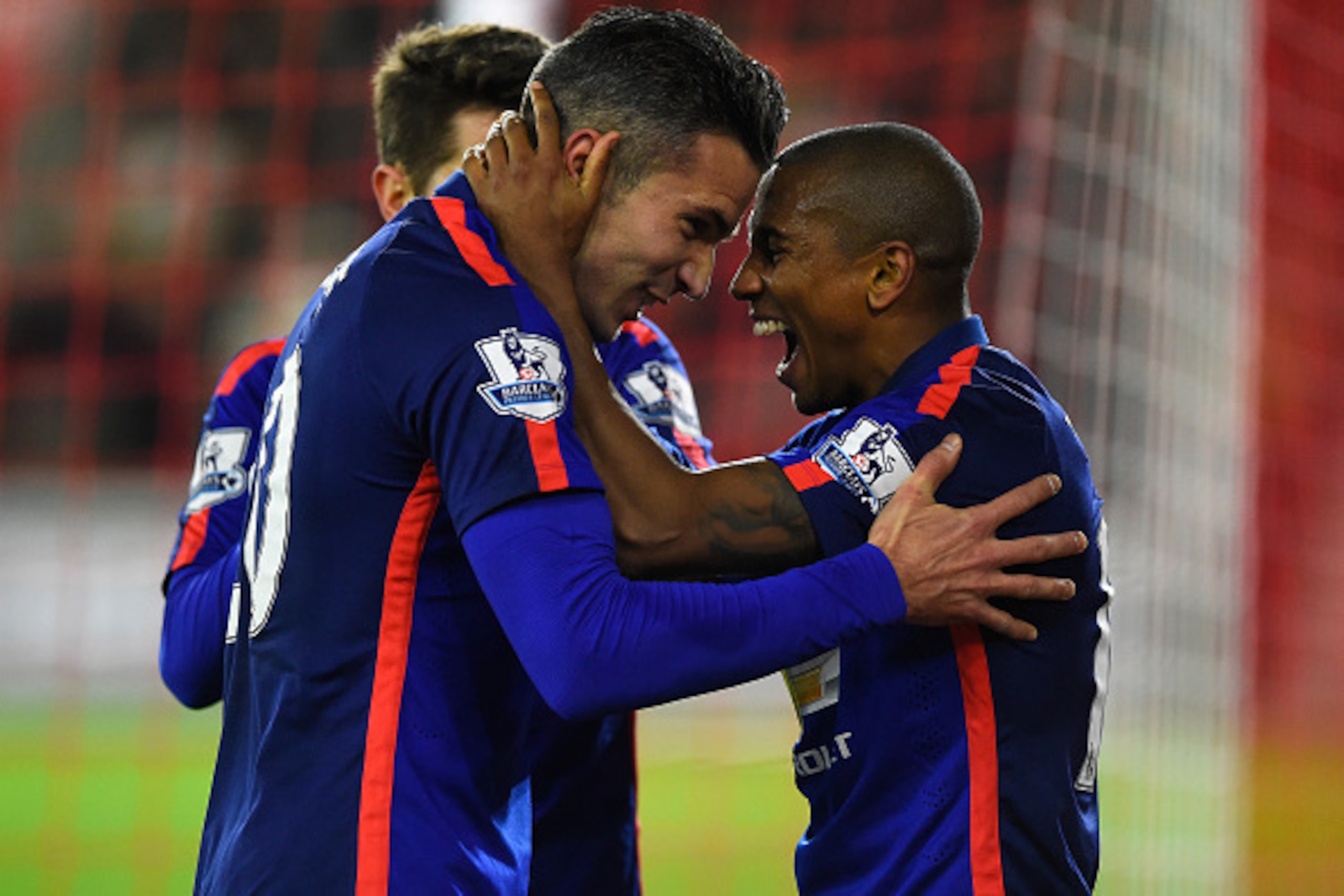 SOUTHAMPTON, ENGLAND - DECEMBER 08:  Robin van Persie of Manchester United celebrates scoring his second goal with Ashley Young of Manchester United during the Barclays Premier League match between Southampton and Manchester United at St Mary's Stadium on
