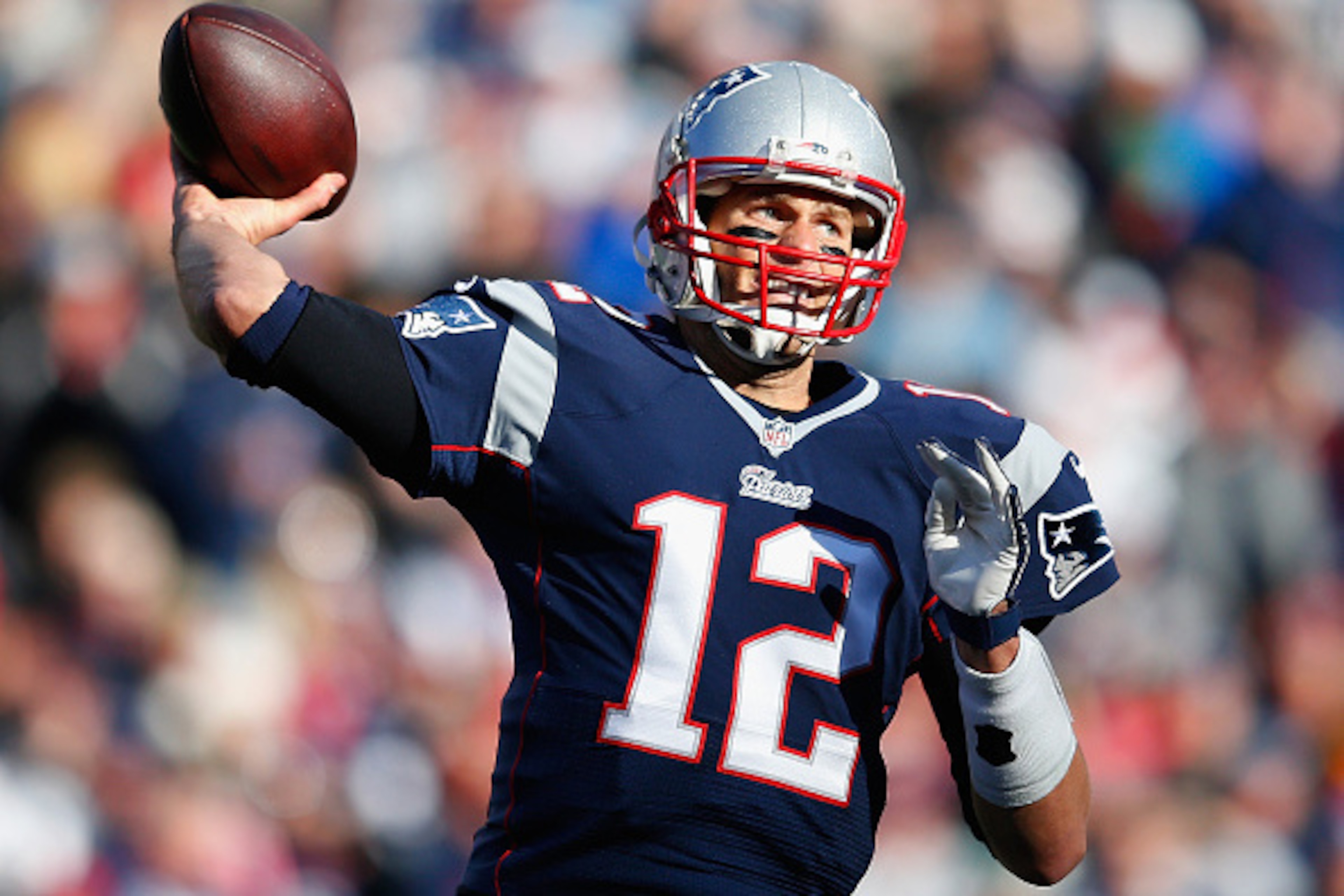 FOXBORO, MA - DECEMBER 14: Tom Brady #12 of the New England Patriots passes the ball during the first quarter against the Miami Dolphins at Gillette Stadium on December 14, 2014 in Foxboro, Massachusetts. (Photo by Jim Rogash/Getty Images) FOXBORO, MA - DECEMBER 14: Tom Brady #12 of the New England Patriots passes the ball during the first quarter against the Miami Dolphins at Gillette Stadium on December 14, 2014 in Foxboro, Massachusetts. (Photo by Jim Rogash/Getty Images)