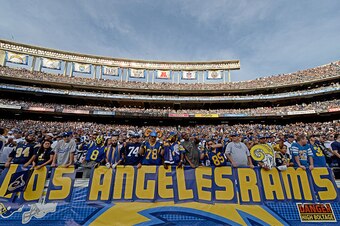 SAN DIEGO, CA - NOVEMBER 23:   Fans of the St. Louis Rams hold a 'Los Angeles Rams' sign against the San Diego Chargers during their NFL Game on November 23, 2014 in San Diego, California. (Photo by Donald Miralle/Getty Images)