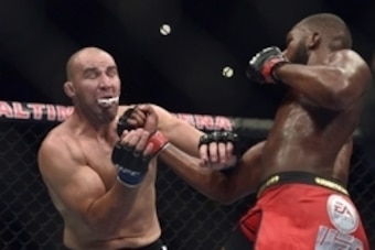 Apr 26, 2014; Baltimore, MD, USA;  Jon Jones hits  Glover Teixeira with an upper cut during the UFC light heavy weight championship fight at  Baltimore Arena. Jones retained the light heavy height championship by defeating  Teixeria.  Mandatory Credit: To
