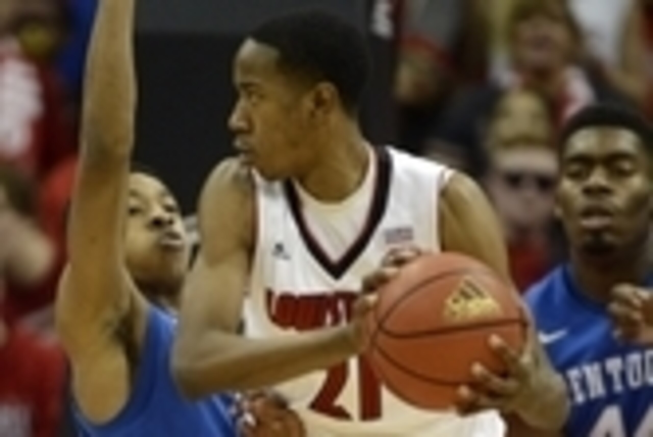 Dec 27, 2014; Louisville, KY, USA; Louisville Cardinals guard Shaqquan Aaron (21) posts up against Kentucky Wildcats guard Tyler Ulis (3) during the first half at KFC Yum! Center. Mandatory Credit: Jamie Rhodes-USA TODAY Sports