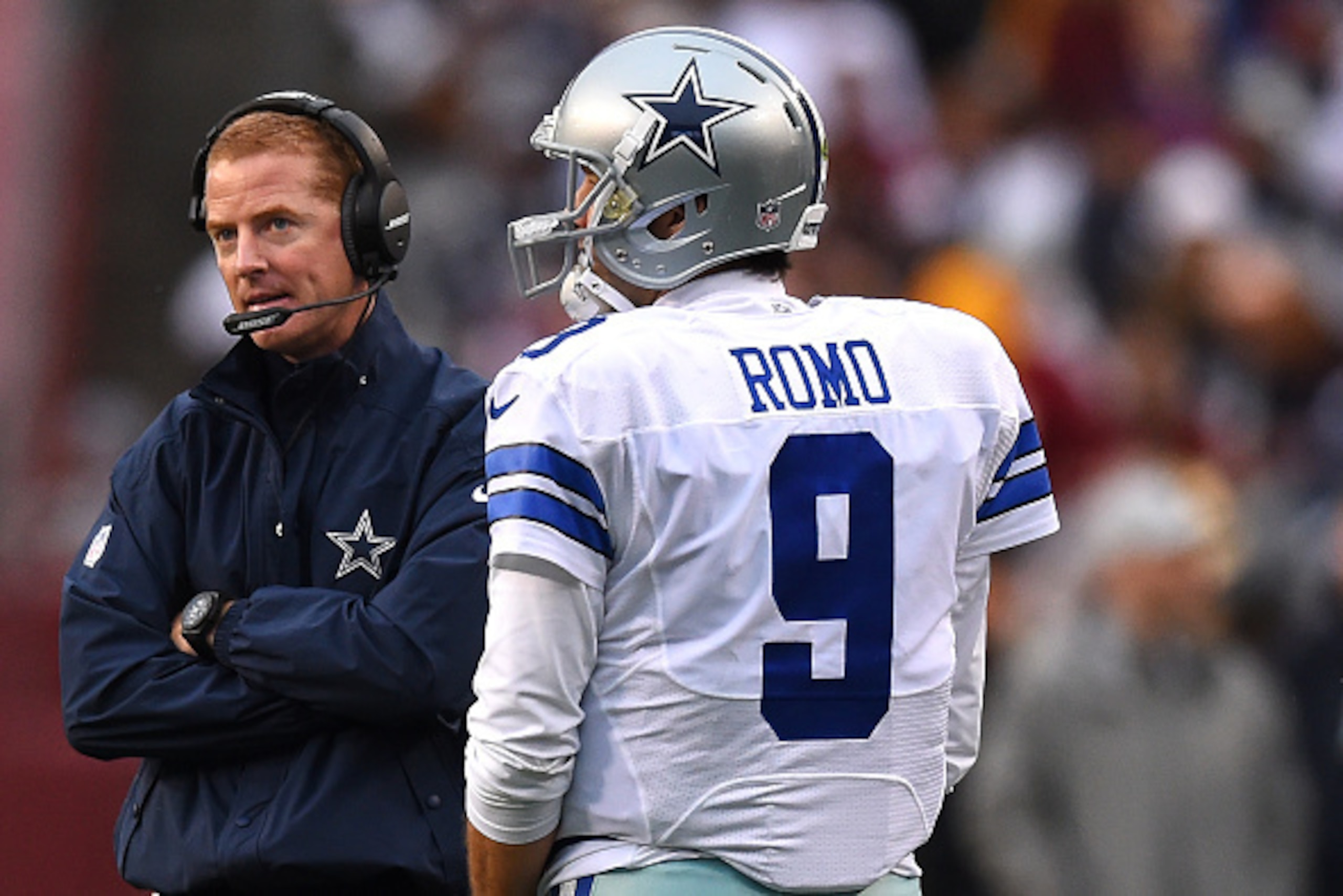 LANDOVER, MD - DECEMBER 28: Quarterback Tony Romo #9 of the Dallas Cowboys stands with head coach Jason Garrett against the Washington Redskins in the second half at FedExField on December 28, 2014 in Landover, Maryland. (Photo by Patrick Smith/Getty Imag