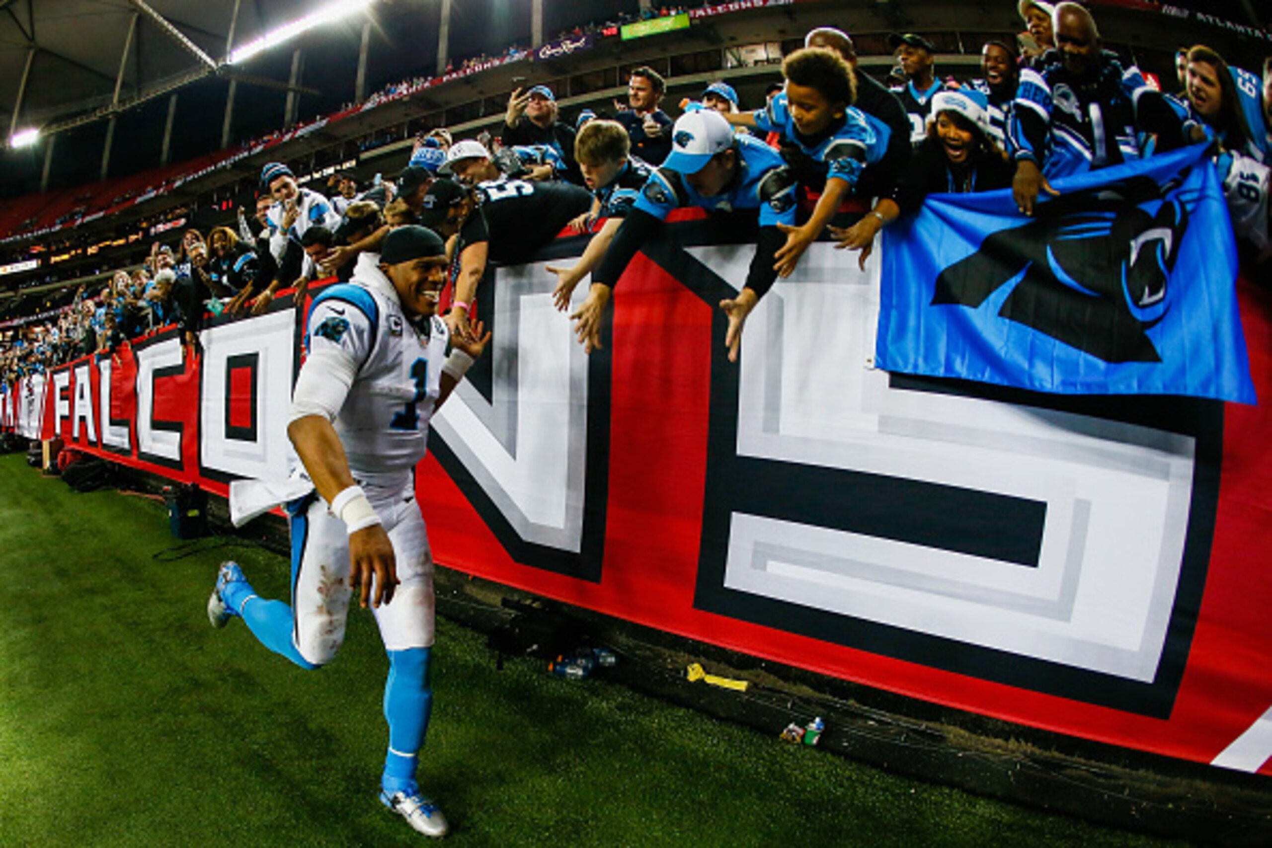 ATLANTA, GA - DECEMBER 28: Cam Newton #1 of the Carolina Panthers celebrates with fans after beating the Atlanta Falcons at the Georgia Dome on December 28, 2014 in Atlanta, Georgia.  (Photo by Kevin C. Cox/Getty Images)