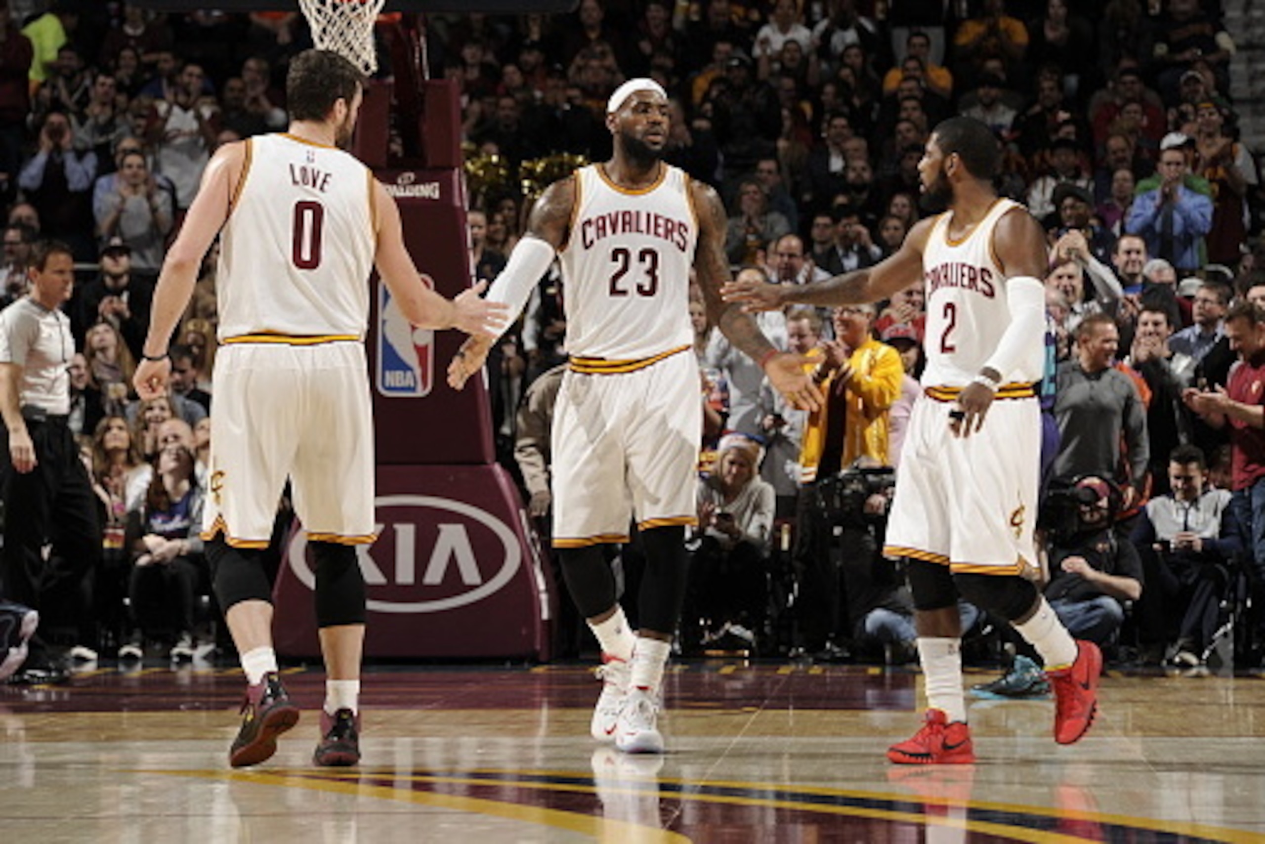CLEVELAND, OH - DECEMBER 15:  LeBron James #23, Kevin Love #0 and Kyrie Irving #2 of the Cleveland Cavaliers shake hands during the game against the Charlotte Hornets on December 15, 2014 at Quicken Loans Arena in Cleveland, Ohio. NOTE TO USER: User expre