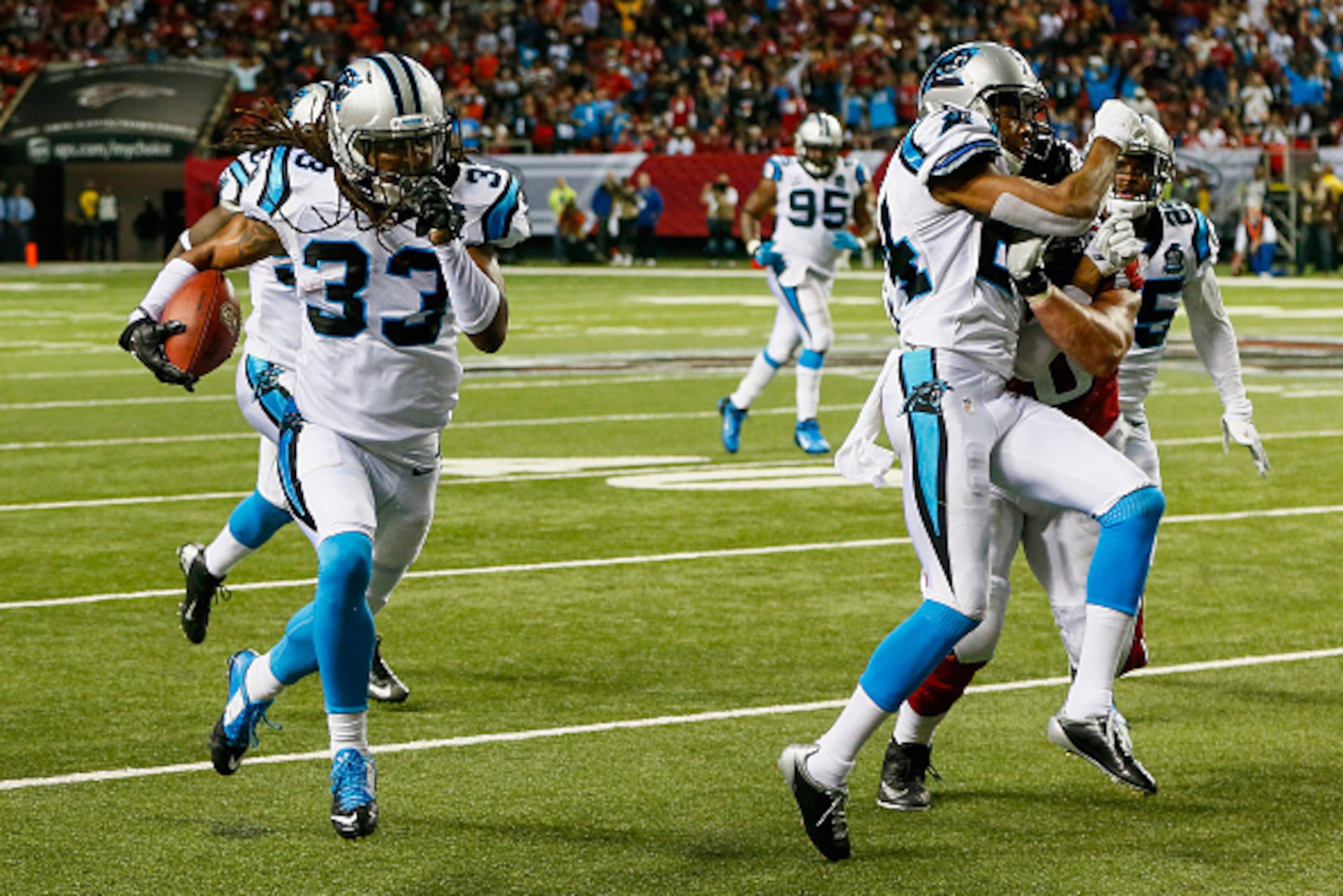 ATLANTA, GA - DECEMBER 28:  Tre Boston #33 of the Carolina Panthers returns an interception for a touchdown in the second half against the Atlanta Falcons at the Georgia Dome on December 28, 2014 in Atlanta, Georgia.  (Photo by Kevin C. Cox/Getty Images)