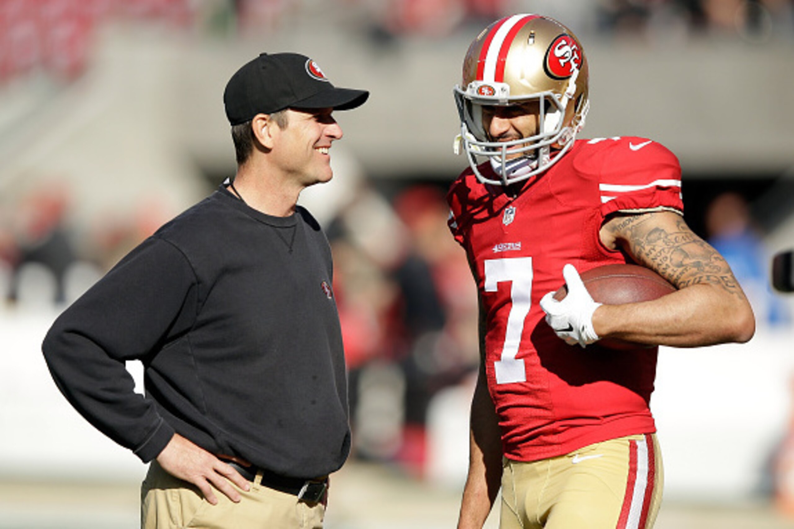 SANTA CLARA, CA - DECEMBER 28:  Head coach Jim Harbaugh of the San Francisco 49ers talks with Colin Kaepernick #7 before their game against the Arizona Cardinals at Levi's Stadium on December 28, 2014 in Santa Clara, California.  (Photo by Ezra Shaw/Getty