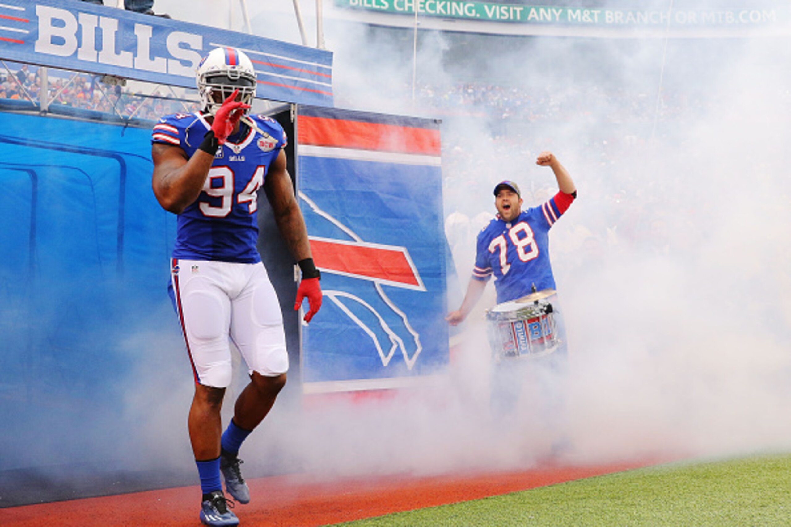 ORCHARD PARK, NY - NOVEMBER 30:   Mario Williams #94 of the Buffalo Bills leads his team onto the field before the game against the Cleveland Browns at Ralph Wilson Stadium on November 30, 2014 in Orchard Park, New York.  (Photo by Brett Carlsen/Getty Ima