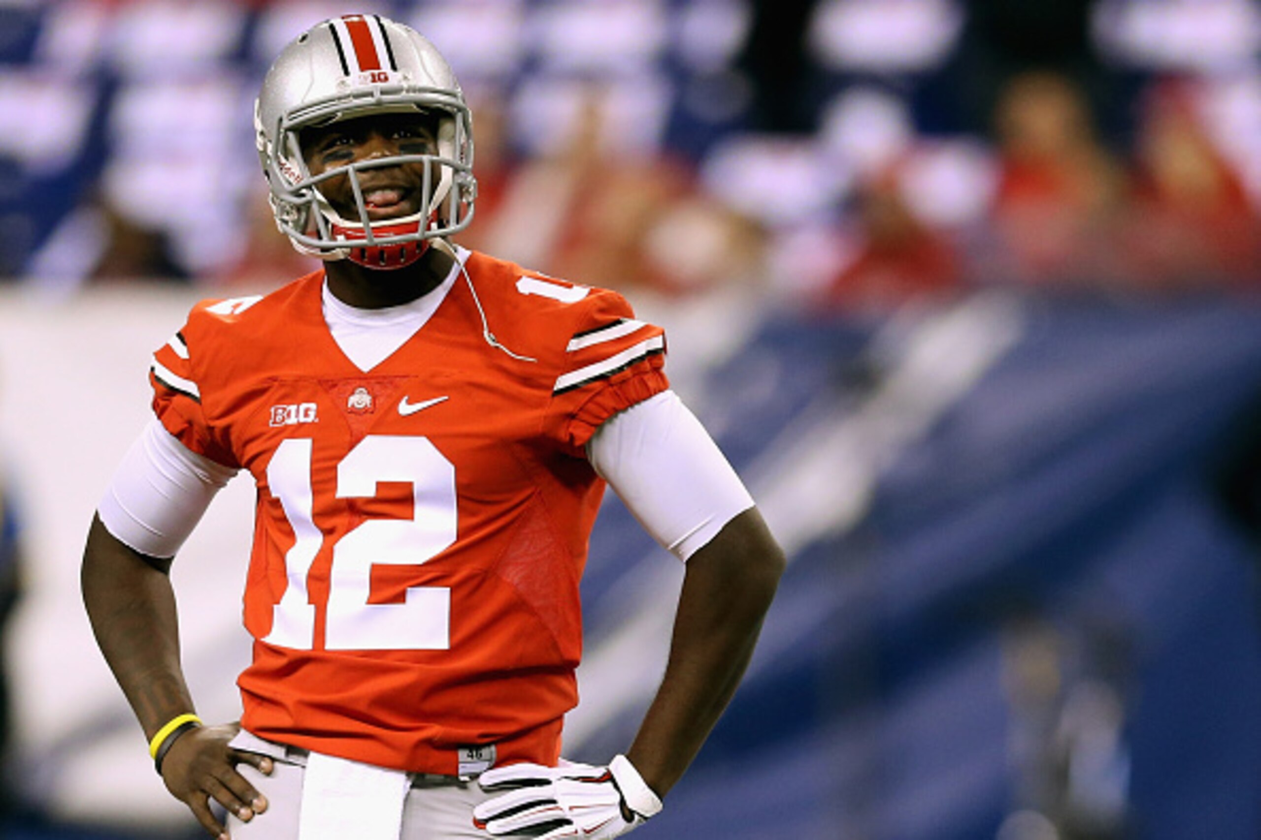 INDIANAPOLIS, IN - DECEMBER 06:  Quarterback Cardale Jones #12 of the Ohio State Buckeyes smiles on the field during warm ups before playing against the Wisconsin Badgers in the Big Ten Championship at Lucas Oil Stadium on December 6, 2014 in Indianapolis