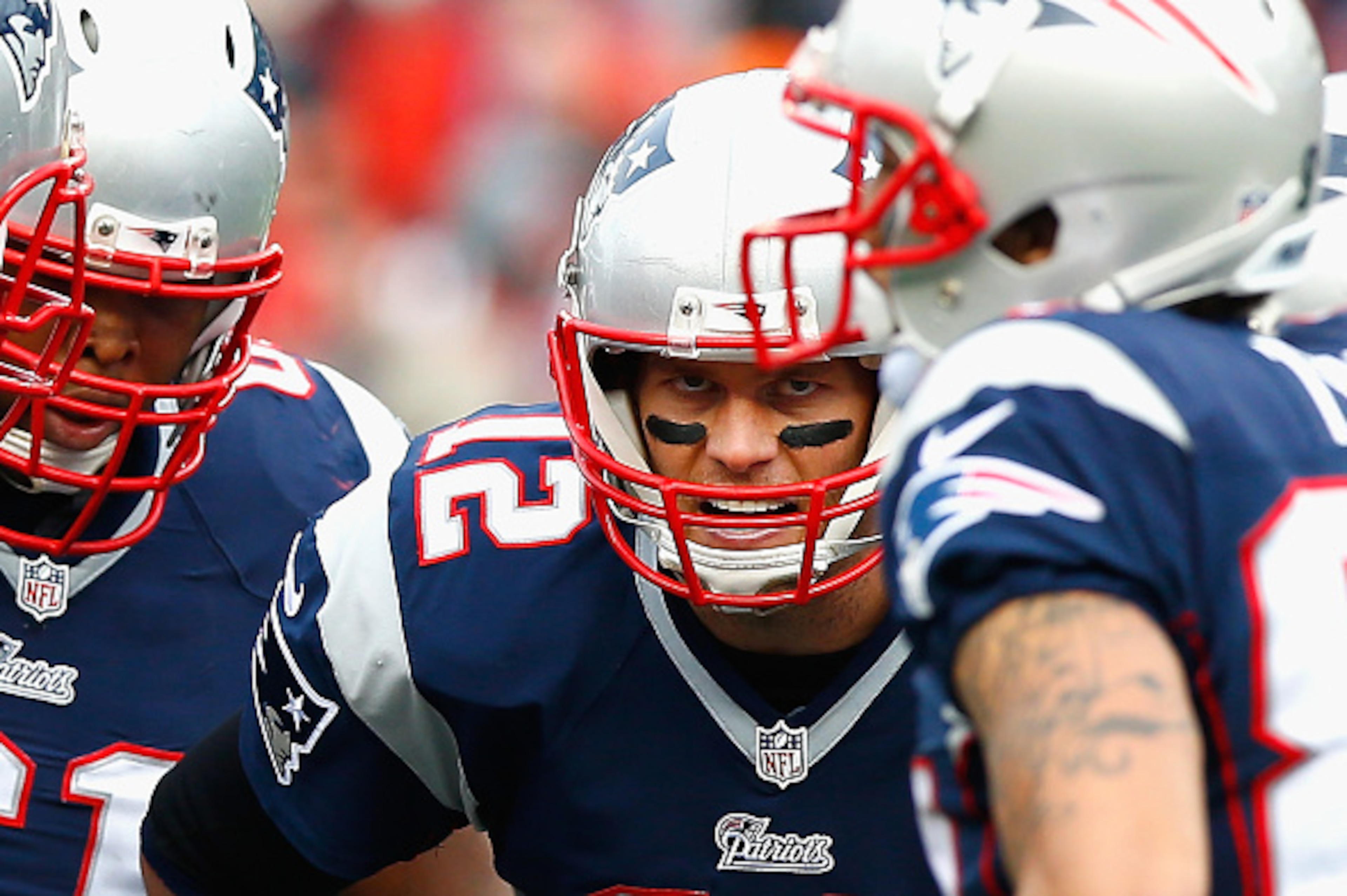 FOXBORO, MA - DECEMBER 28:  Tom Brady #12 of the New England Patriots reacts in the huddle during the second quarter against the Buffalo Bills at Gillette Stadium on December 28, 2014 in Foxboro, Massachusetts.  (Photo by Jared Wickerham/Getty Images)