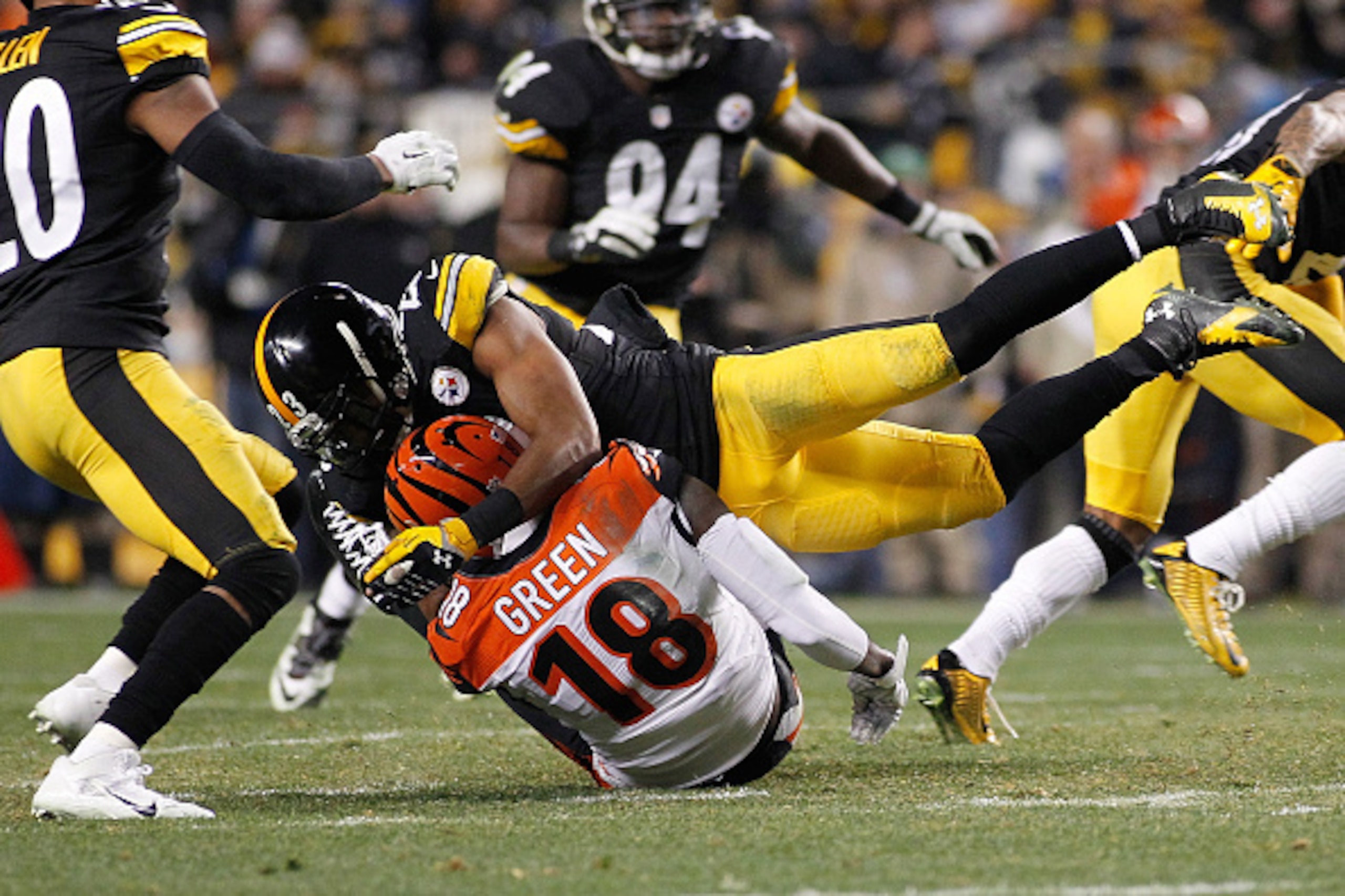 PITTSBURGH, PA - DECEMBER 28:  A.J. Green #18 of the Cincinnati Bengals is hit and injured on the play by Mike Mitchell #23 of the Pittsburgh Steelers at Heinz Field on December 28, 2014 in Pittsburgh, Pennsylvania.  (Photo by Justin K. Aller/Getty Images