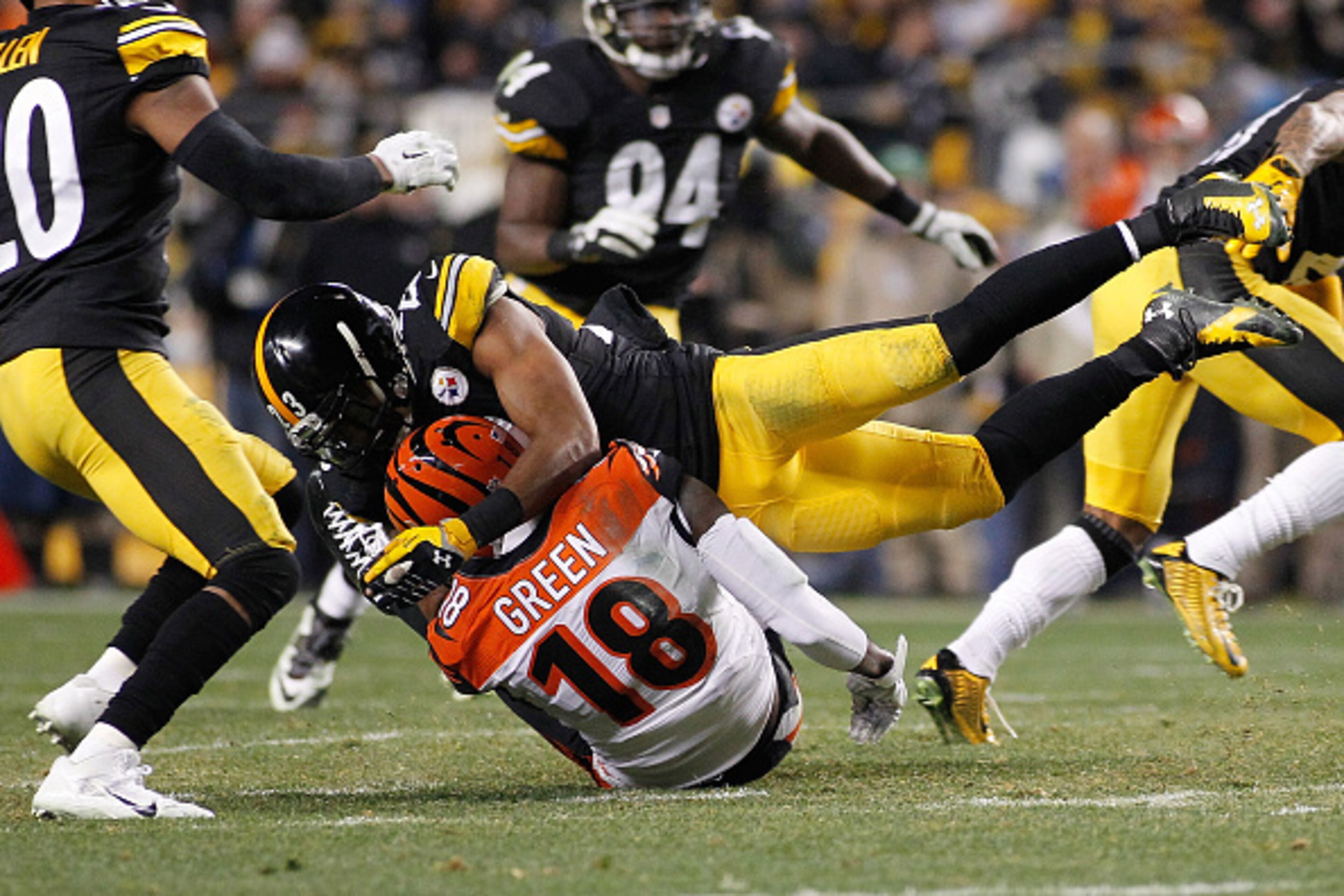 PITTSBURGH, PA - DECEMBER 28: A.J. Green #18 of the Cincinnati Bengals is hit and injured on the play by Mike Mitchell #23 of the Pittsburgh Steelers at Heinz Field on December 28, 2014 in Pittsburgh, Pennsylvania. (Photo by Justin K. Aller/Getty Images PITTSBURGH, PA - DECEMBER 28: A.J. Green #18 of the Cincinnati Bengals is hit and injured on the play by Mike Mitchell #23 of the Pittsburgh Steelers at Heinz Field on December 28, 2014 in Pittsburgh, Pennsylvania. (Photo by Justin K. Aller/Getty Images