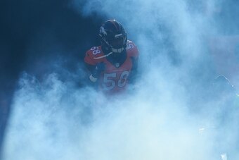 DENVER, CO - DECEMBER 28:  Outside linebacker Von Miller #58 of the Denver Broncos emerges from the tunnel during player introductions before a game against the Oakland Raiders at Sports Authority Field at Mile High on December 28, 2014 in Denver, Colorad