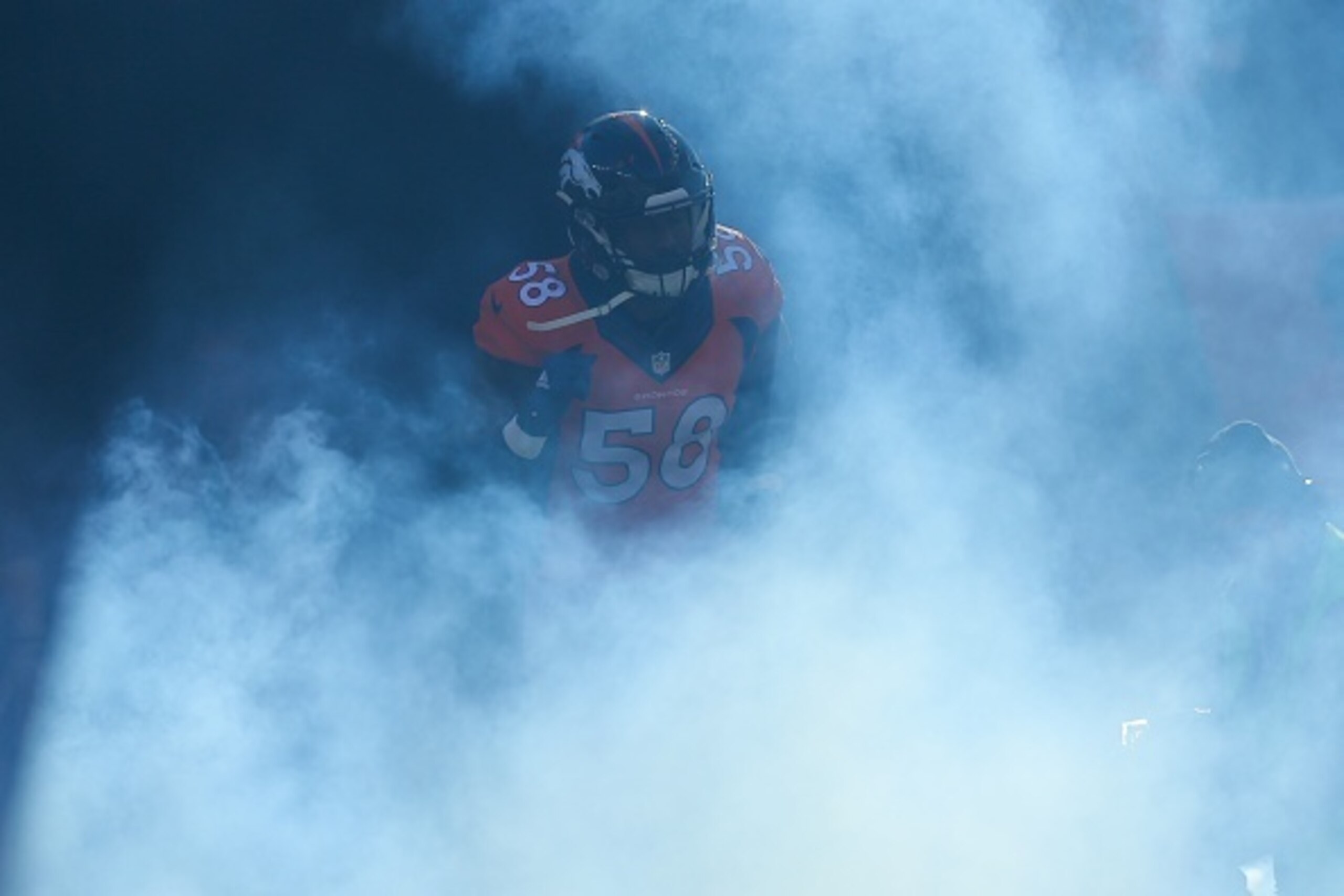 DENVER, CO - DECEMBER 28:  Outside linebacker Von Miller #58 of the Denver Broncos emerges from the tunnel during player introductions before a game against the Oakland Raiders at Sports Authority Field at Mile High on December 28, 2014 in Denver, Colorad