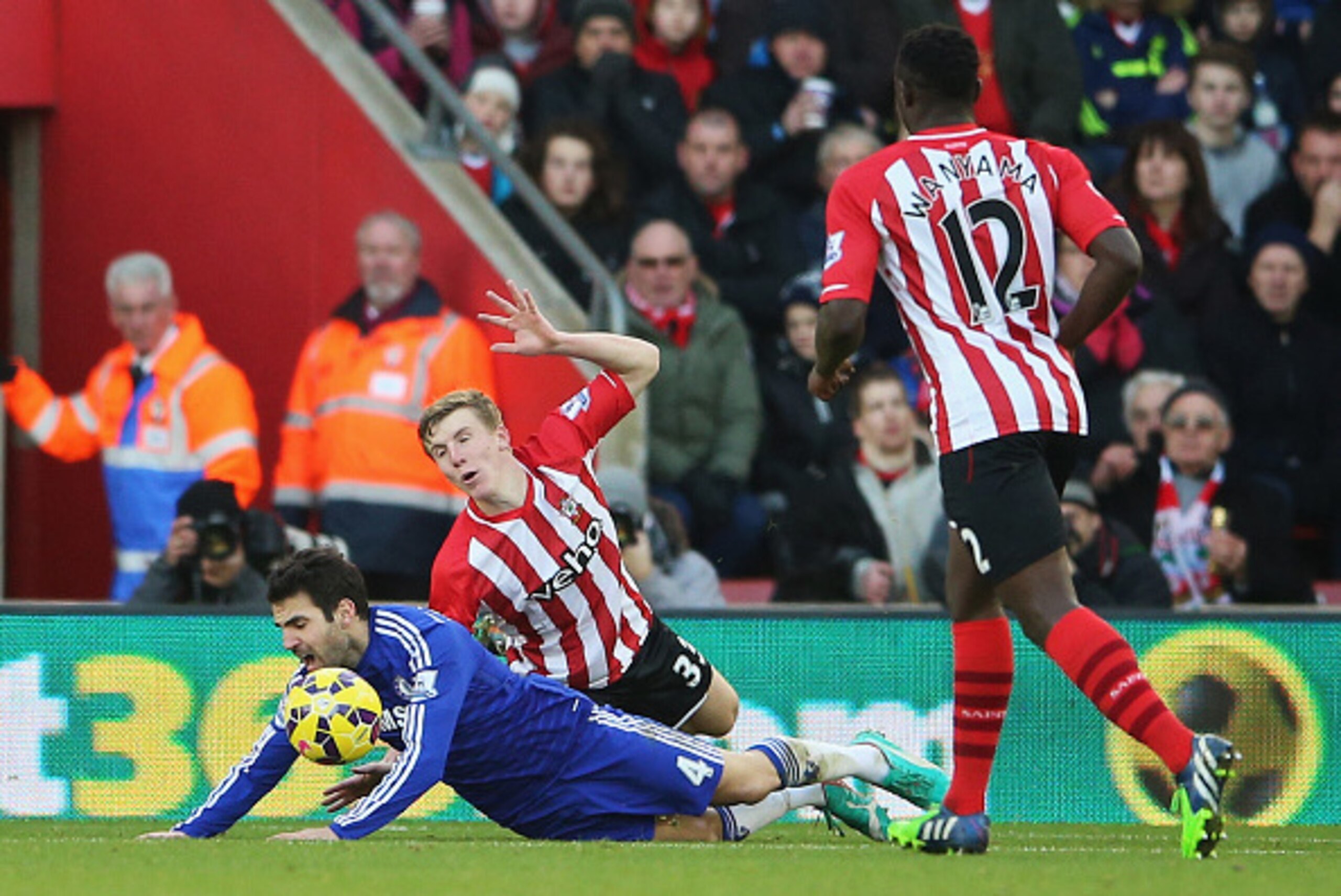 SOUTHAMPTON, ENGLAND - DECEMBER 28: Cesc Fabregas of Chelsea goes down in the penalty area after a challenge by Matt Targett of Southampton and is booked for diving during the Barclays Premier League match between Southampton and Chelsea at St Mary's Stad