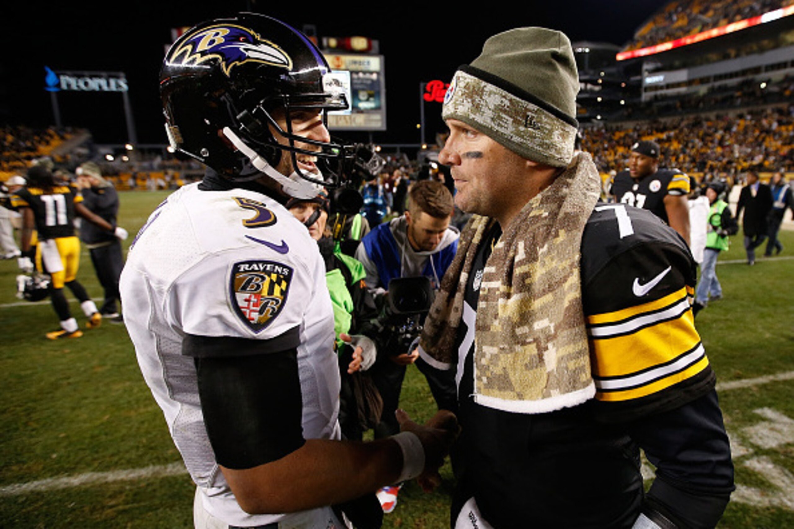 PITTSBURGH, PA - NOVEMBER 02:  Ben Roethlisberger #7 of the Pittsburgh Steelers is congratulated by Joe Flacco #5 of the Baltimore Ravens after a 43-23 win at Heinz Field on November 2, 2014 in Pittsburgh, Pennsylvania.  (Photo by Gregory Shamus/Getty Ima