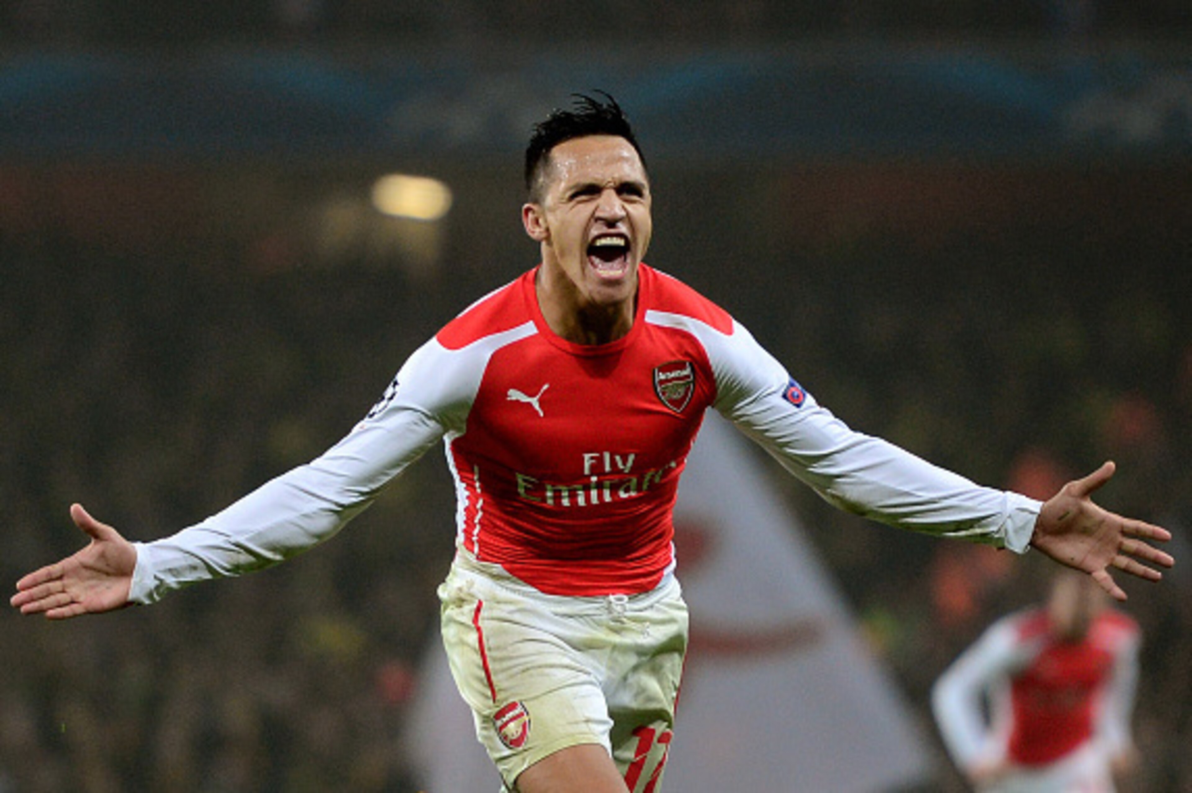 LONDON, ENGLAND - NOVEMBER 26:  Alexis Sanchez of Arsenal celebrates after scoring his team's second goal during the UEFA Champions League Group D match between Arsenal and Borussia Dortmund at the Emirates Stadium on November 26, 2014 in London, United K