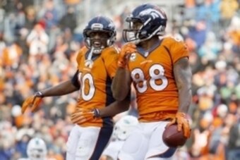 Nov 23, 2014; Denver, CO, USA; Denver Broncos wide receiver Demaryius Thomas (88) celebrates with wide receiver Emmanuel Sanders (10) after scoring a touchdown during the first half against the Miami Dolphins at Sports Authority Field at Mile High. Mandat