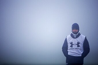 ENFIELD, ENGLAND - DECEMBER 11: Manager Andre Villas-Boas keeps an eye on the session in the fog during Tottenham Hotspur training session ahead of their UEFA Europa League group match against FC Anji at Hotspur Way on December 11, 2013 in London, England